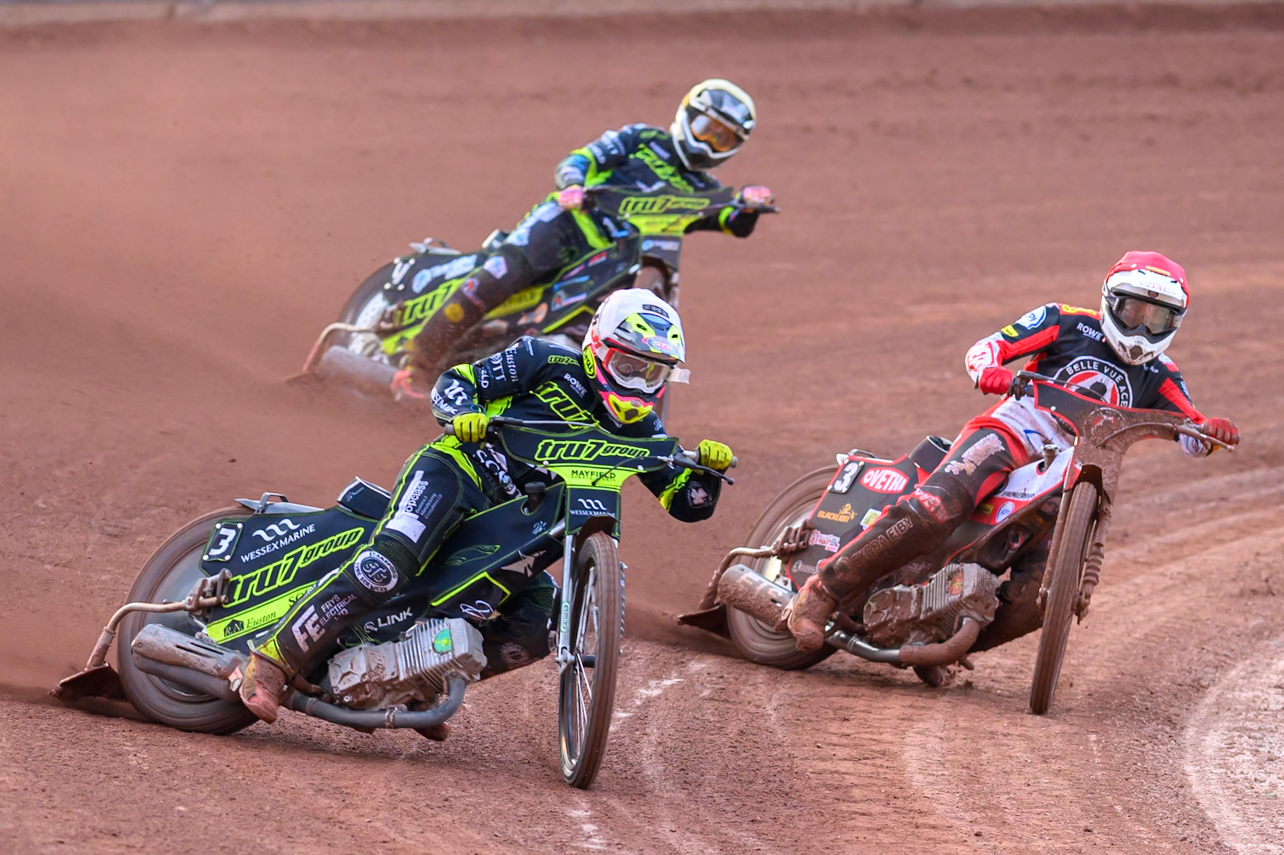 Richard Lawson of Ipswich Witches  in White leading Peter Kildemand of Belle Vue Aces  in Red and Scott Nicholls of Ipswich Witches  in Yellow during the Rowe Motor Oil Premiership match between Belle Vue Aces and Ipswich Witches at the National Speedway Stadium, Manchester on Monday 20th April 2026. (Photo: Ian Charles | MI News)