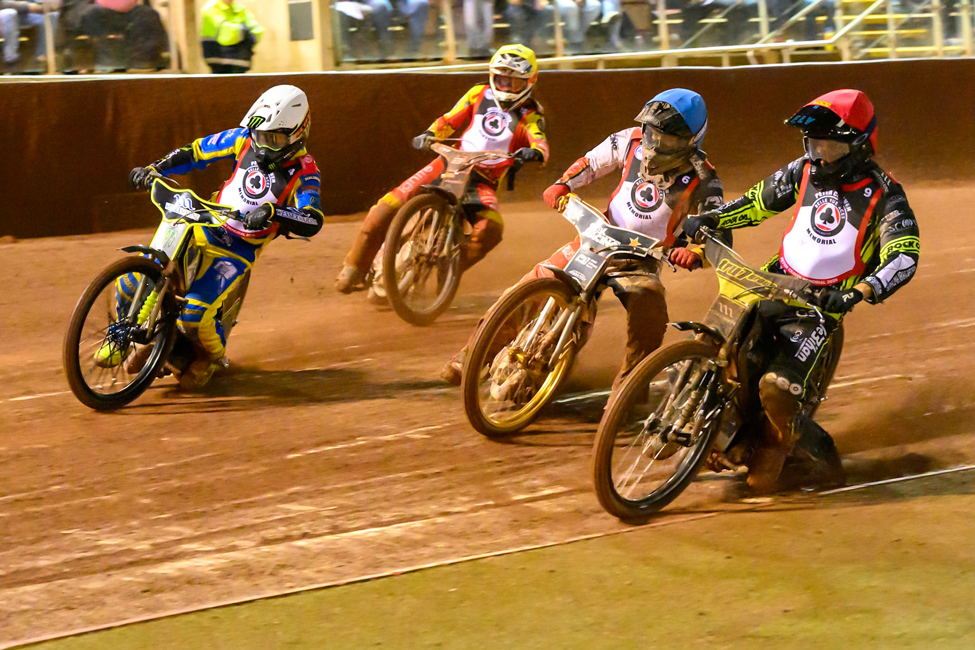 Adam Ellis in Red rides inside Norick Blodorn  in Blue and Chris Holder  with Sam Masters  in Yellow behind during the Peter Craven Memorial Trophy at the National Speedway Stadium, Manchester, on Monday 16th March 2026. (Photo: Ian Charles | MI News)