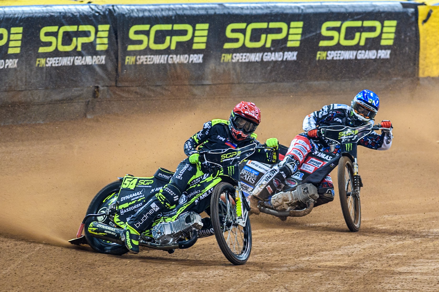 Martin Vaculik (54) of Slovakia in Red leading Fredrik Lindgren (66) of Sweden in Blue during the FIM Speedway Grand Prix of Great Britain at The Principality Stadium, Cardiff on Saturday 17th August 2024. (Photo: Ian Charles | MI News)