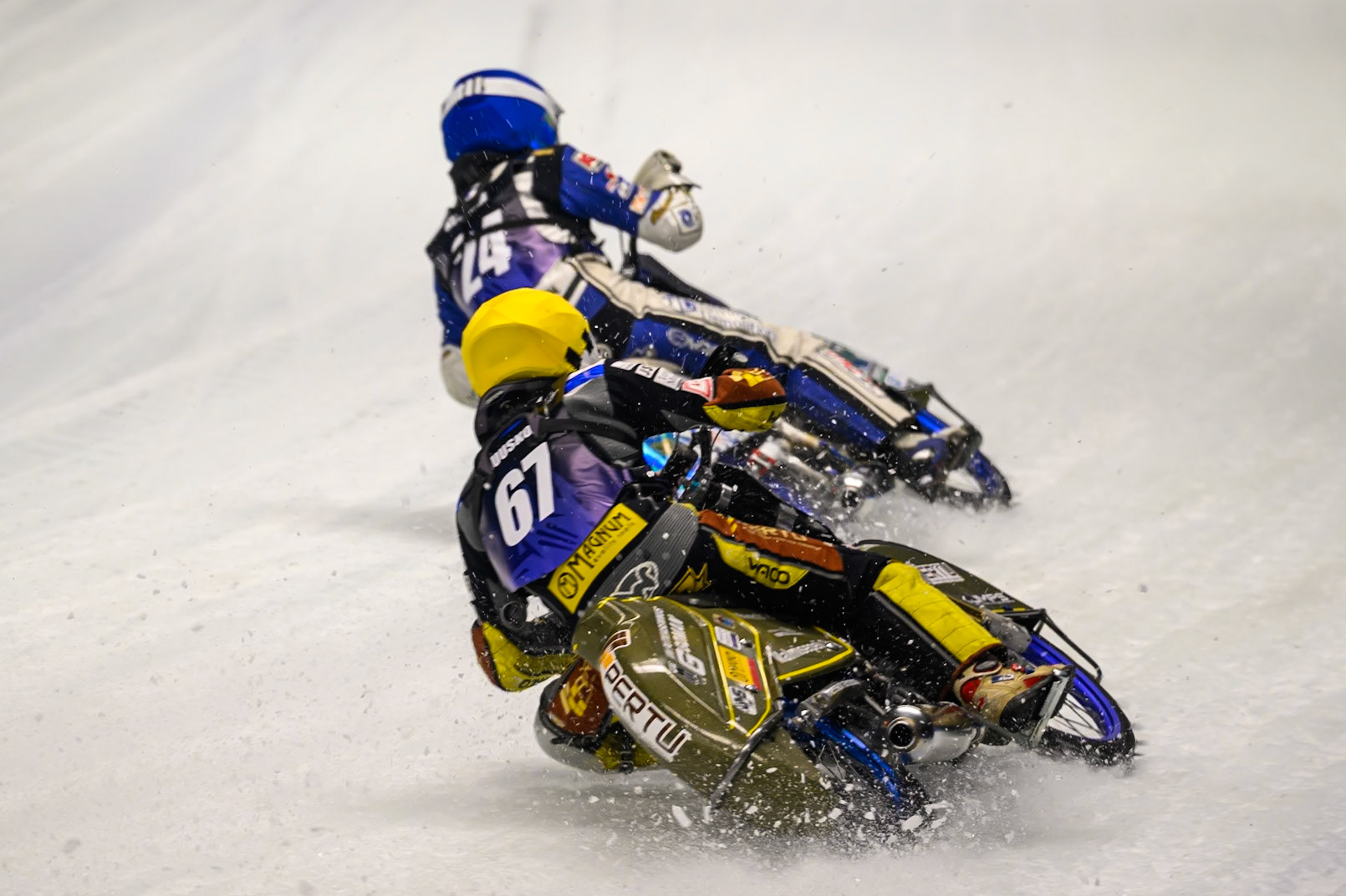 Heikki Huusko (67) of Finland  in Yellow chases Max Koivula (24) of Finland in Blue during the Ice Speedway Gladiators World Championship Final 1 at Max-Aicher-Arena, Inzell on Saturday 14th March 2026. (Photo: Ian Charles | MI News)