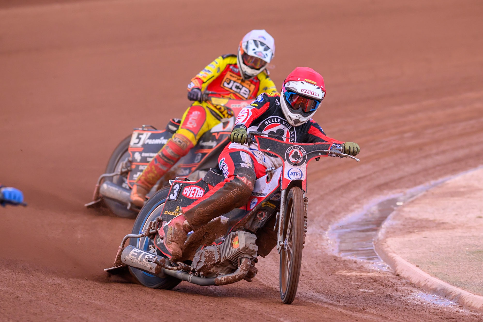 Peter Kildemand of Belle Vue Aces in Red leading Sam Masters of Leicester Lions in White during the Rowe Motor Oil Premiership match between Belle Vue Aces and Leicester Lions at the National Speedway Stadium, Manchester on Monday 3rd August 2026. (Photo: Ian Charles | MI News)