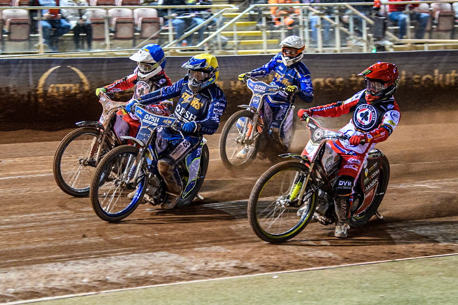 Jaimon Lidsey of Belle Vue Aces in Red rides inside Chris Harris of Kings Lynn Stars in Yellow and Jake Mulford of Belle Vue Aces in Blue’ with Niels-Kristian Iversen of Kings Lynn Stars behind during the Rowe Motor Oil Premiership match between Belle Vue Aces and King's Lynn Stars at the National Speedway Stadium, Manchester on Monday 5th April 2025. (Photo: Ian Charles | MI News)