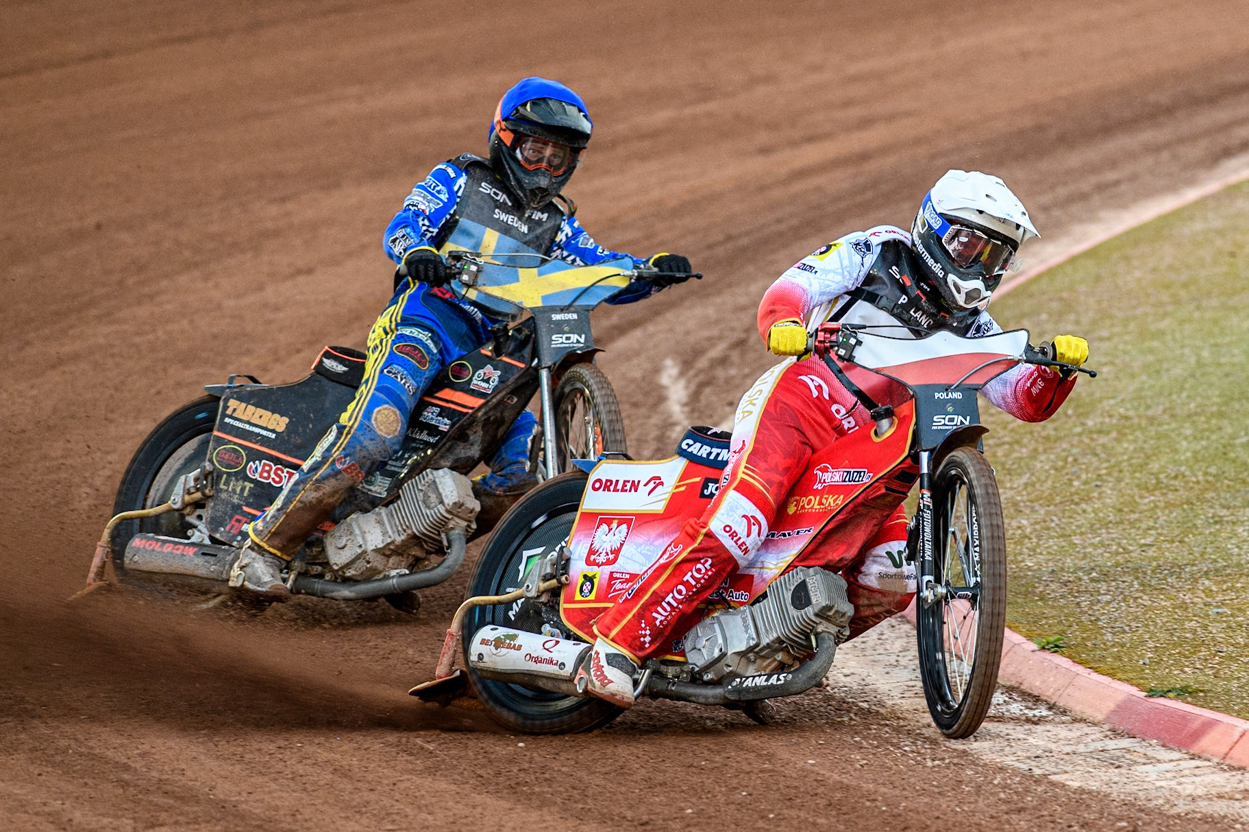 Dominik Kubera of Poland in Red leading Jacob Thorssell of Sweden in Blue during the Monster Energy FIM Speedway of Nations Semi-Final 1 at the National Speedway Stadium, Manchester on Tuesday 9th July 2024. (Photo: Ian Charles | MI News)