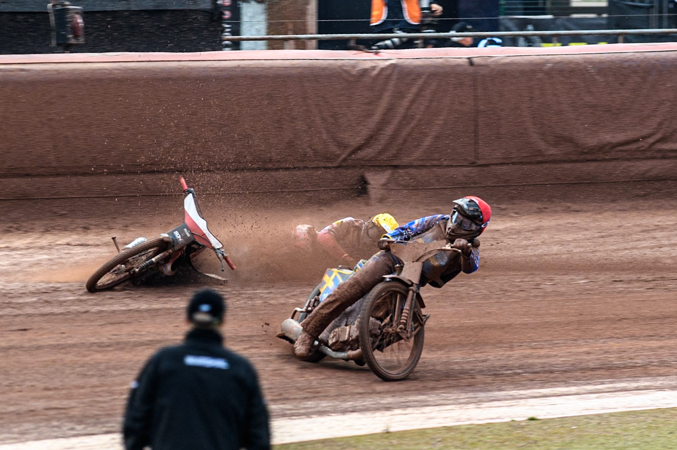 Bartosz Banbor of Poland falls behind Philip Hellström-Bängs of Sweden in Red during the Monster Energy FIM Speedway of Nations 2 (Under 21) Final at the National Speedway Stadium, Manchester on Friday 12th July 2024. (Photo: Ian Charles | MI News)
