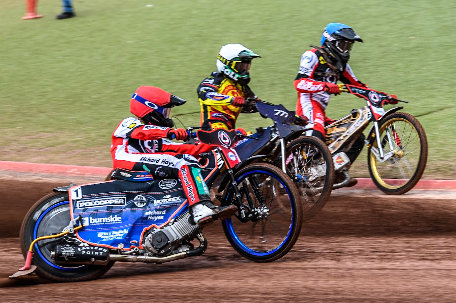 Belle Vue Aces' Brady Kurtz  in Red rides outside Birmingham Brummies' Piotr Pawlicki  in White and Belle Vue Aces' Norick Blödorn  in Blue during the Rowe Motor Oil Premiership match between Belle Vue Aces and Birmingham Brummies at the National Speedway Stadium, Manchester on Monday 6th May 2024. (Photo: Ian Charles | MI News)