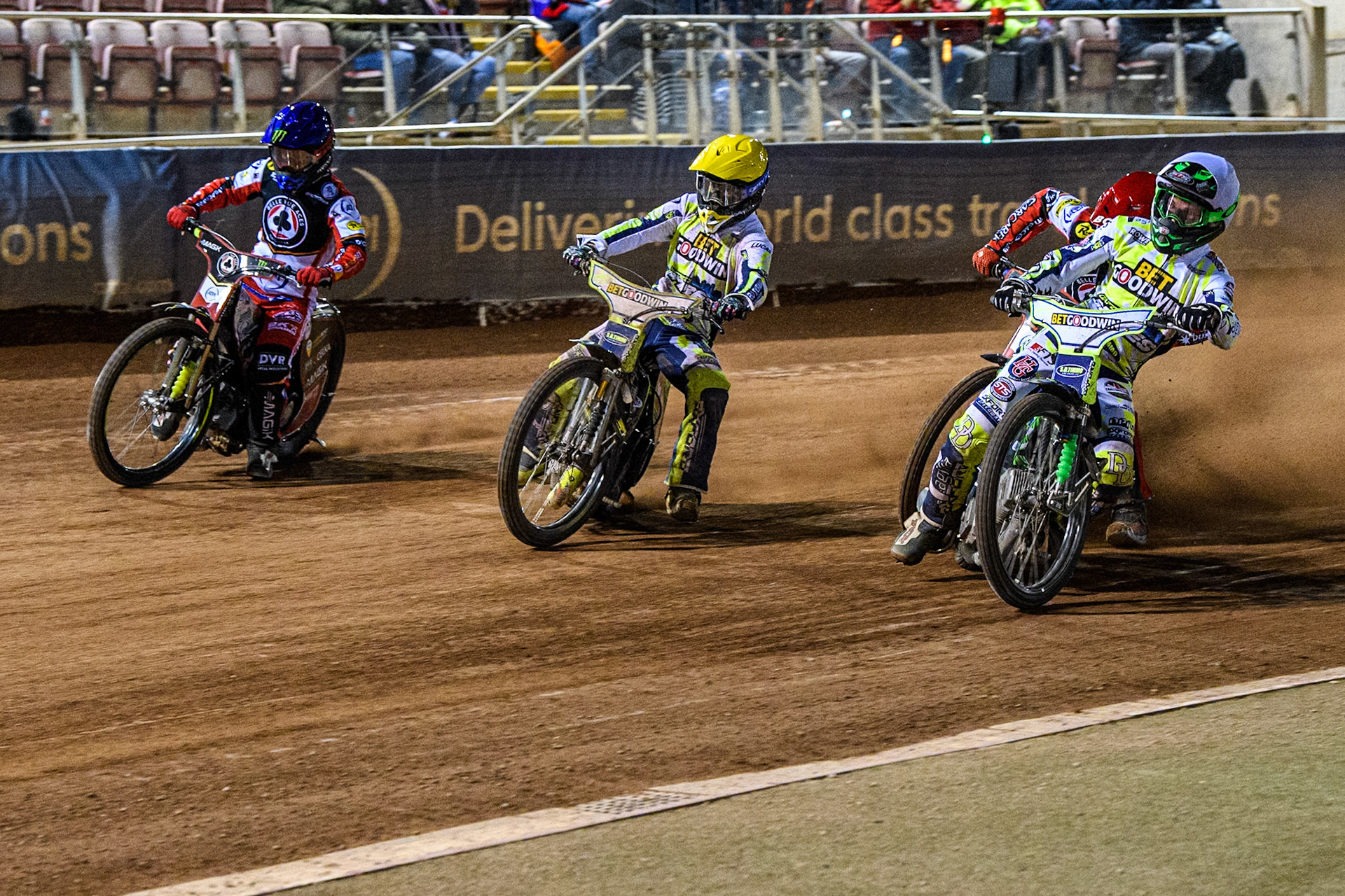 Oxford Spires' Charles Wright in White rides inside Oxford Spires' Rohan Tungate in Yellow, and Belle Vue Aces' Jaimon Lidsey in Blue with Belle Vue Aces' Brady Kurtz in Red behind during the Rowe Motor Oil Premiership match between Belle Vue Aces and Oxford Spires at the National Speedway Stadium, Manchester on Monday 14th April 2025. (Photo: Ian Charles | MI News)