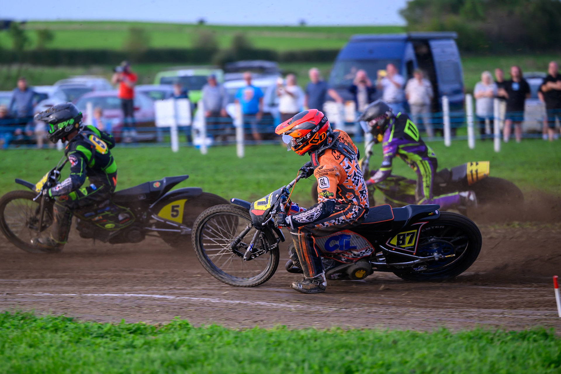 British Masters (Solos): Mickie Simpson (87) rides inside Paul Cooper (11)  and Max Perry (5) during the British Masters Grasstrack Championship at Lower Marsh Farm, Much Hoole, Preston in Lancashire, England on Sunday 13th September 2026. (Photo: Ian Charles | MI News)