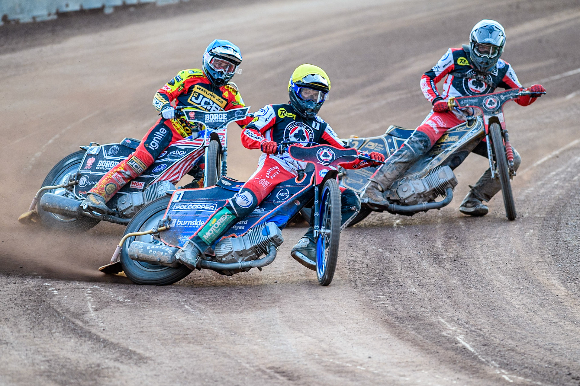 Belle Vue Aces' Brady Kurtz in Yellow leading Leicester Lions' Luke Becker in Blue and Belle Vue Aces' Norick Blodorn in White during the Rowe Motor Oil Premiership match between Leicester Lions and Belle Vue Aces at the Pidcock Motorcycles Arena, Leicester on Thursday 25th July 2024. (Photo: Ian Charles | MI News)