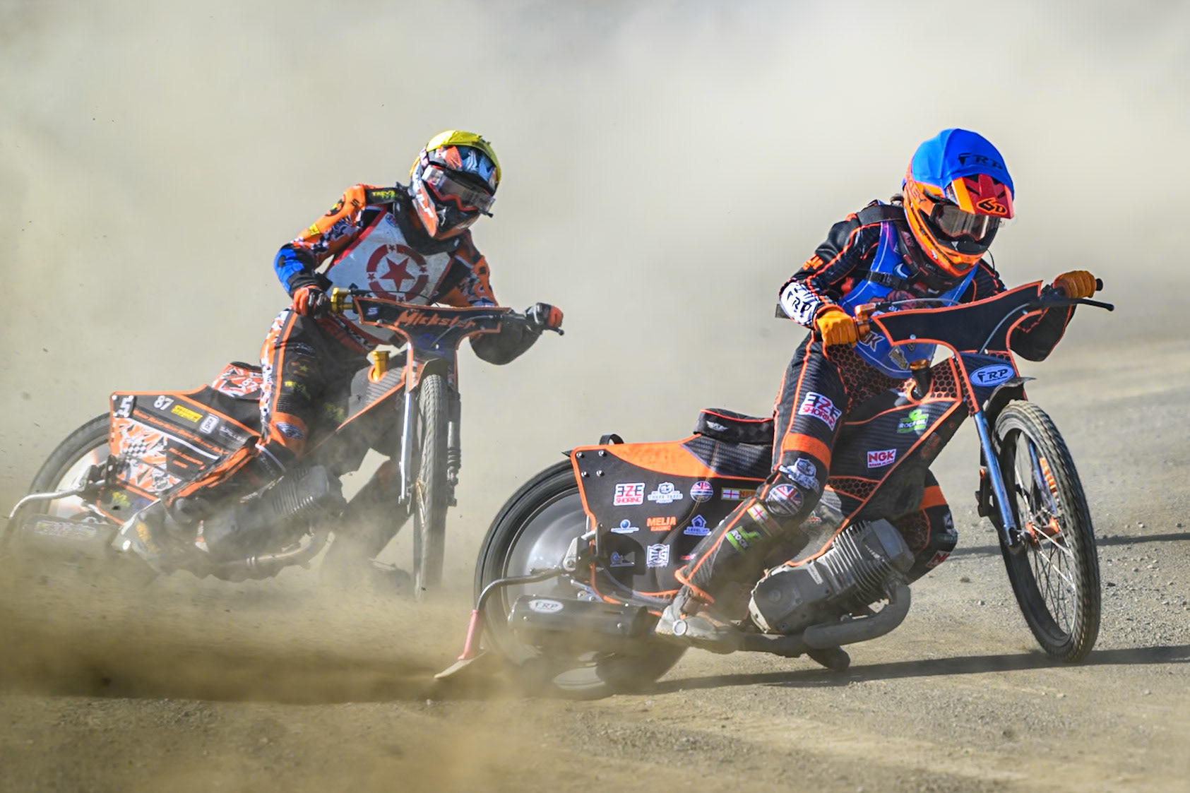 Jack Smith of Buxton Bulls in Blue leading Mickie Simpson of Stoke Potters  in Yellow during the National Development League Challenge match between Buxton Bulls and Stoke Potters at Hi-Edge Speedway, Buxton on Sunday 24th May 2026. (Photo: Ian Charles | MI News)