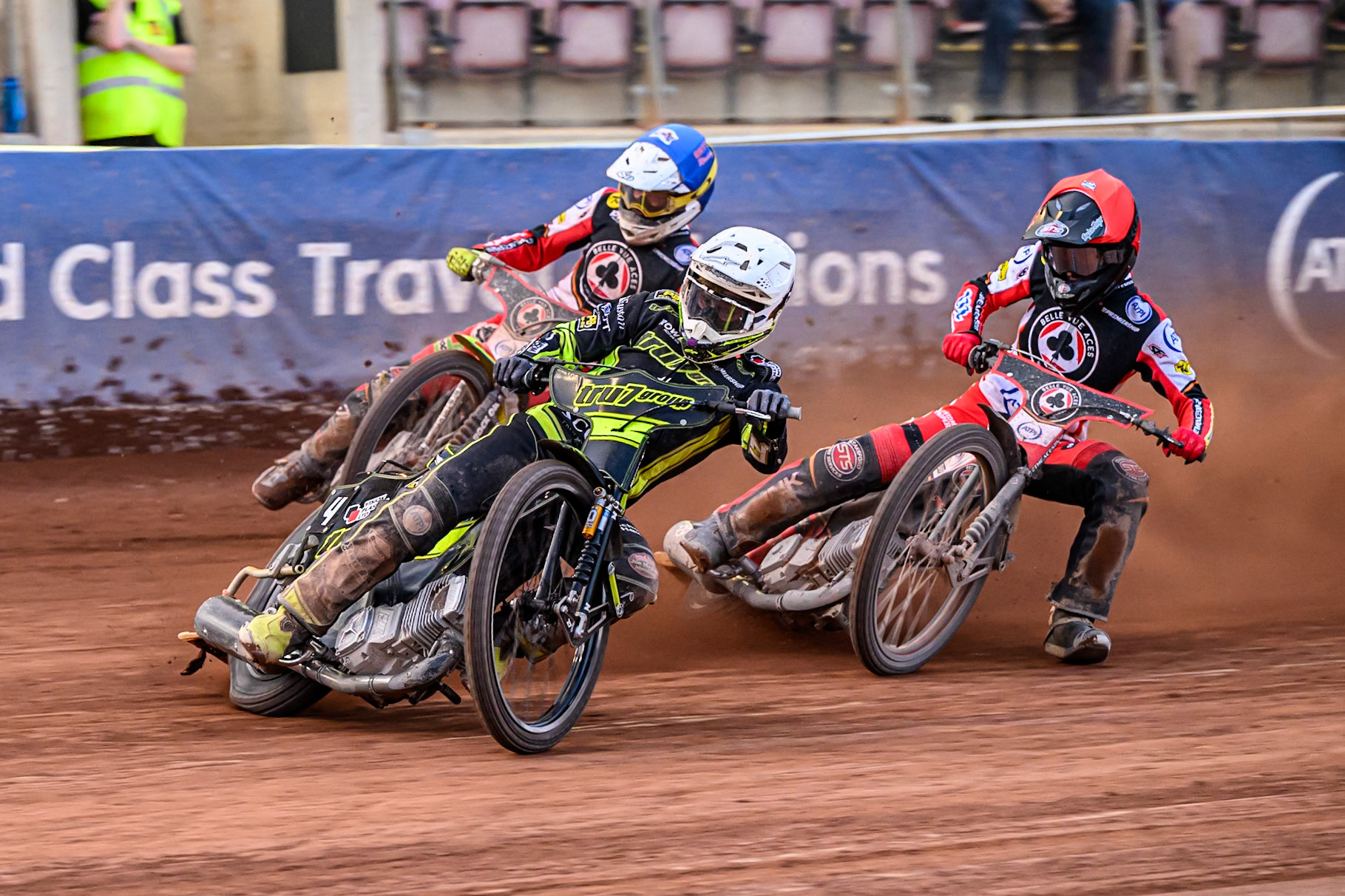 Ipswich Witches' Tom Brennan  in White leading Belle Vue Aces' Tate Zischke  in Blue and Belle Vue Aces' Zach Cook  in Red during the Rowe Motor Oil Premiership match between Belle Vue Aces and Ipswich Witches at the National Speedway Stadium, Manchester on Monday 30th June 2025. (Photo: Ian Charles | MI News)
