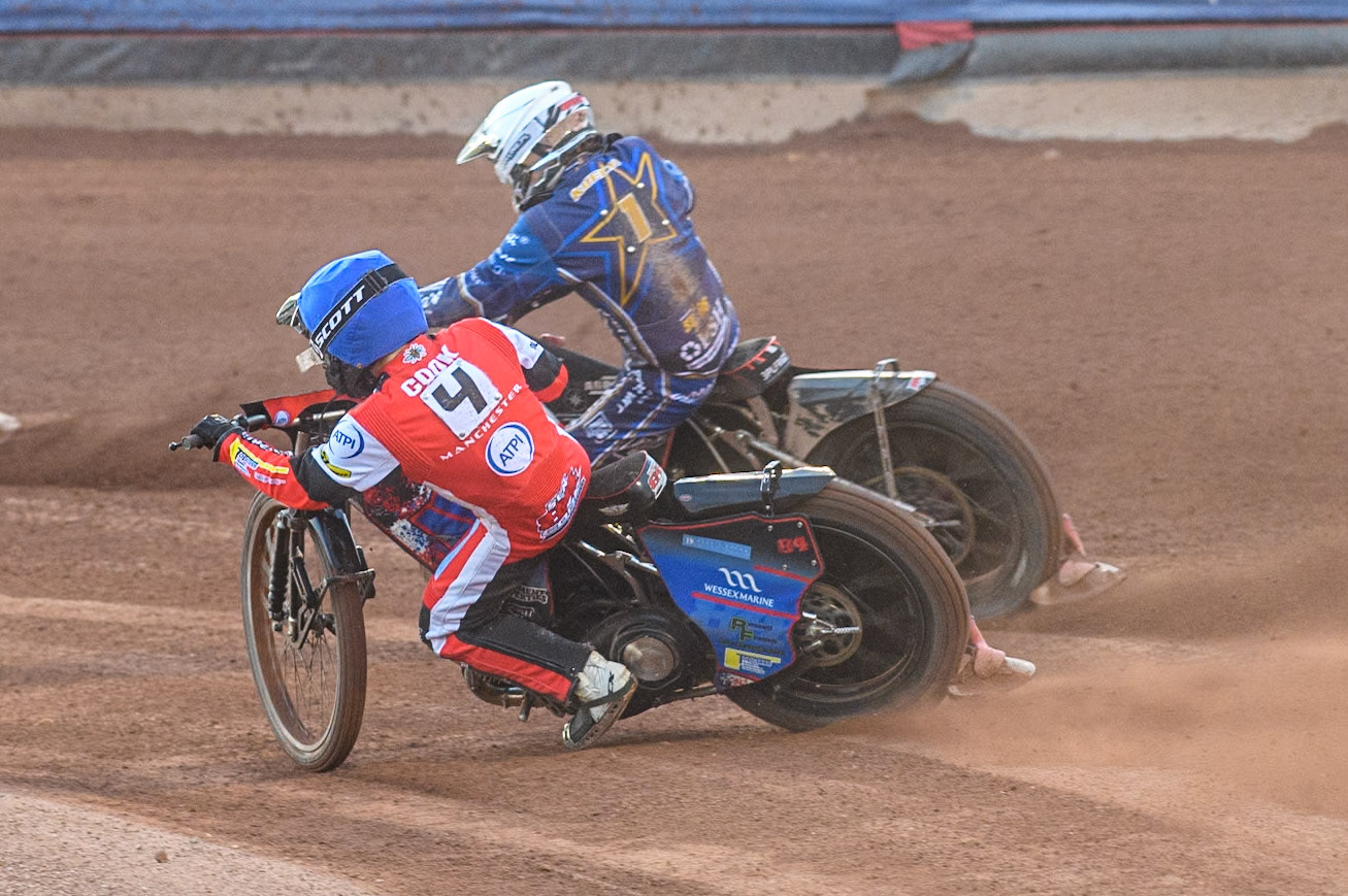 Belle Vue Aces' Ben Cook  in Blue rides inside Kings Lynn Stars' Jan Kvech  in White during the Rowe Motor Oil Premiership match between Belle Vue Aces and King's Lynn Stars at the National Speedway Stadium, Manchester on Monday 12th August 2024. (Photo: Ian Charles | MI News)