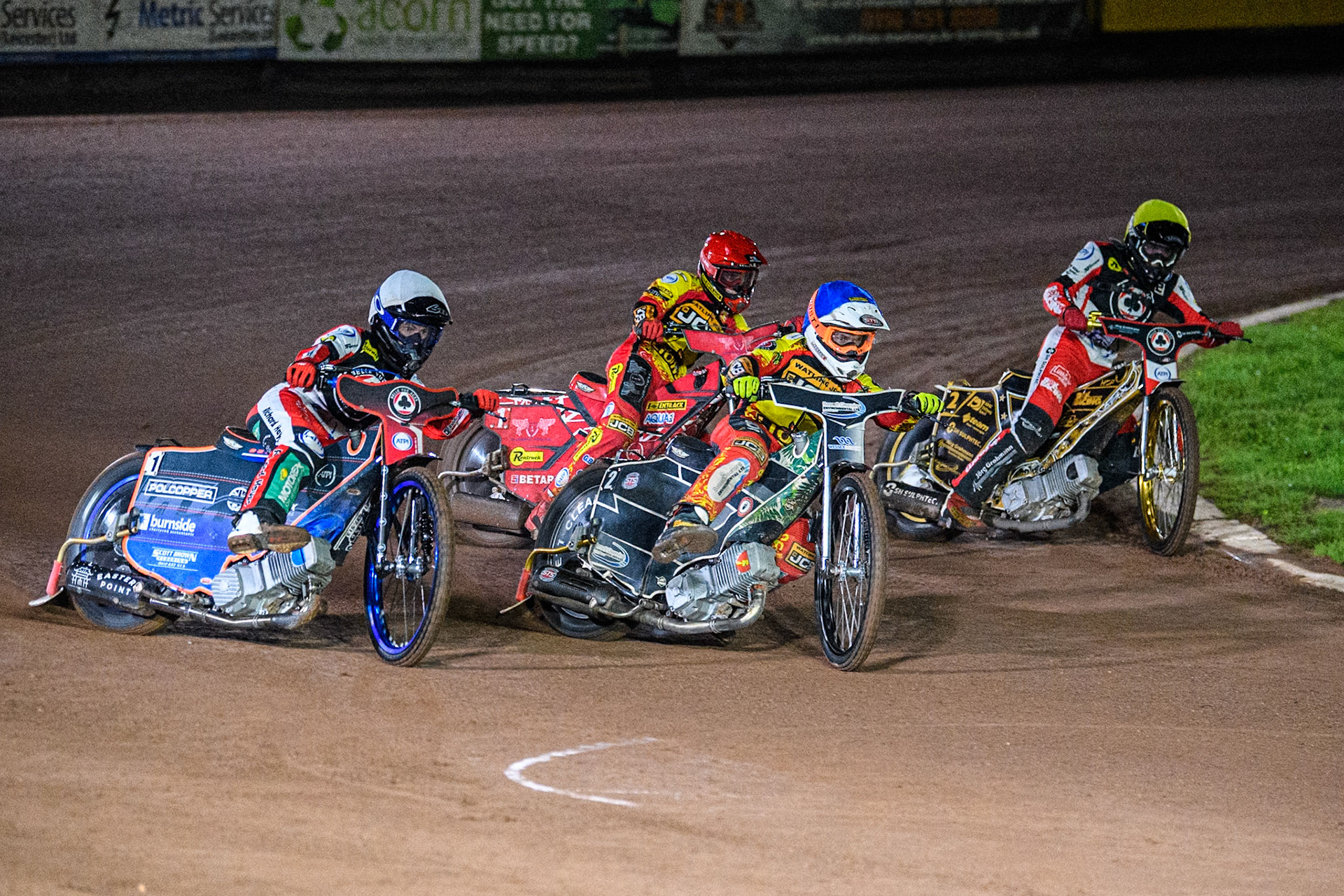 Belle Vue Aces' Brady Kurtz in White rides outside Leicester Lions' Richard Lawson in Blue, Leicester Lions' Max Fricke in Red and Belle Vue Aces' Norick Blodorn in Yellow during the Rowe Motor Oil Premiership Grand Final 2nd Leg between Leicester Lions and Belle Vue Aces at the Pidcock Motorcycles Arena, Leicester on Thursday 26th September 2024. (Photo: Ian Charles | MI News)