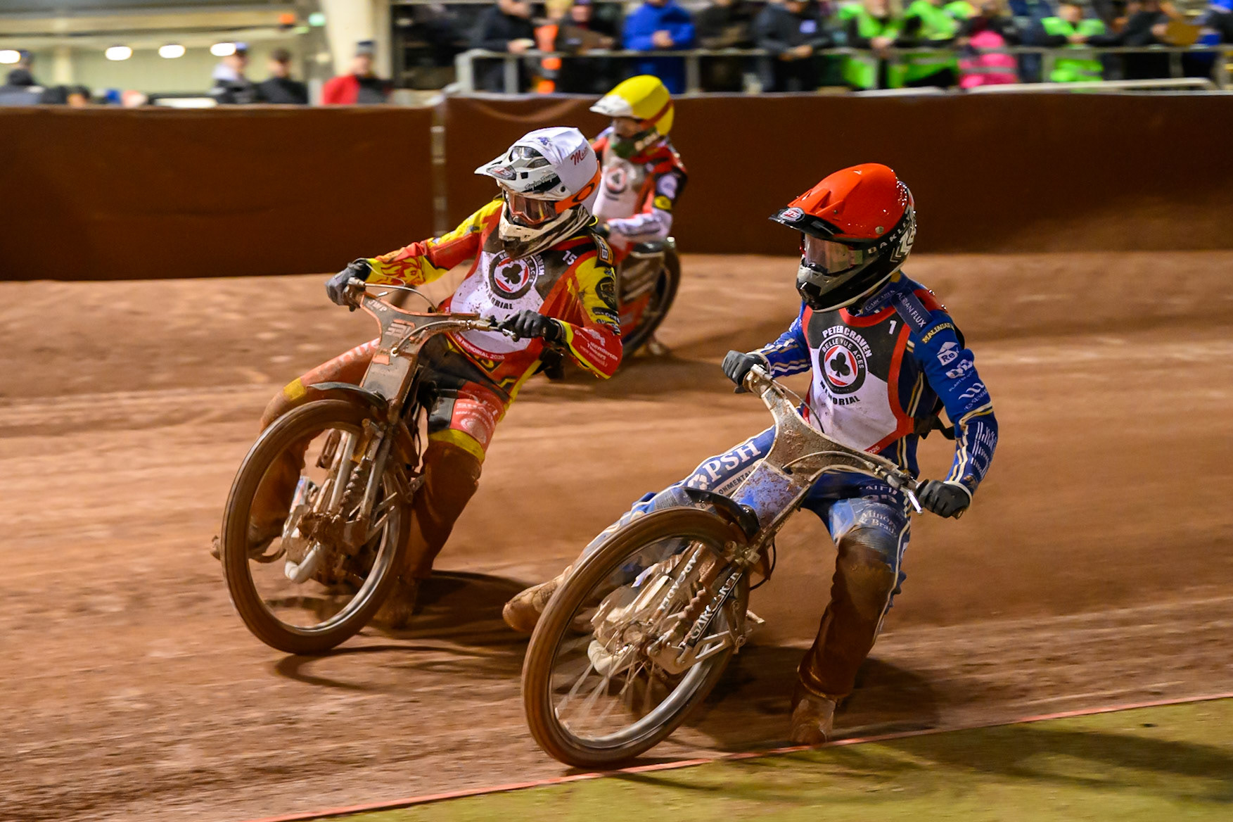 Nicolai Klindt  in Red rides inside Sam Masters  in White and Brady Kurtz  in Yellow during the Peter Craven Memorial Trophy at the National Speedway Stadium, Manchester, on Monday 16th March 2026. (Photo: Ian Charles | MI News)