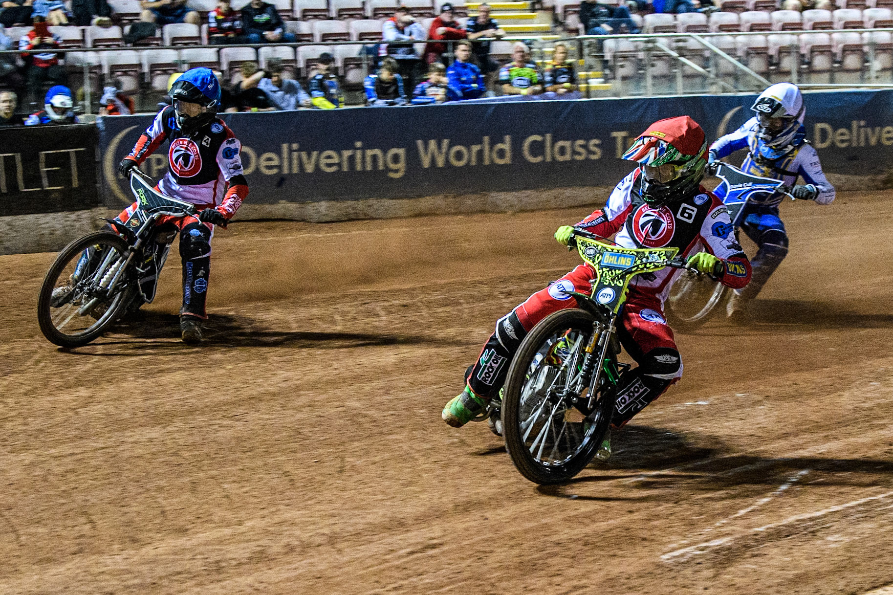Belle Vue Colts' William Cairns in Red rides inside Belle Vue Colts' Matt Marson in Blue with Edinburgh Monarchs' Sam McGurk in White behind during the WSRA National Development League match between Belle Vue Aces and Edinburgh Monarchs at the National Speedway Stadium, Manchester on Friday 30th August 2024. (Photo: Ian Charles | MI News)