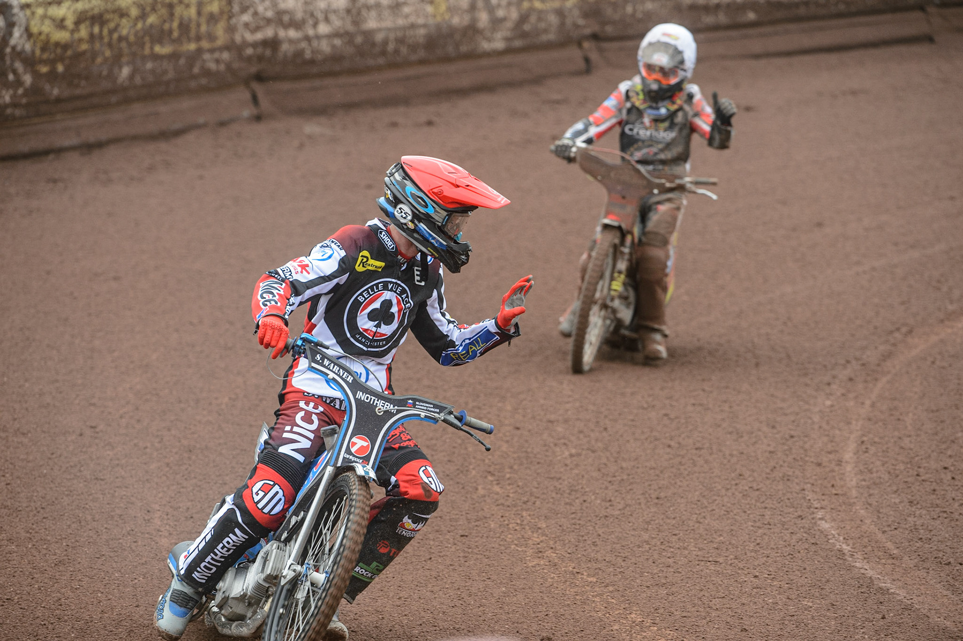 MANCHESTER, UK. MAY 2ND  Matej Žagar  (Red) acknowledges Michael Palm Toft  (White) after heat 5 during the SGB Premiership match between Belle Vue Aces and Peterborough at the National Speedway Stadium, Manchester on Monday 2nd May 2022. (Credit: Ian Charles | MI News)