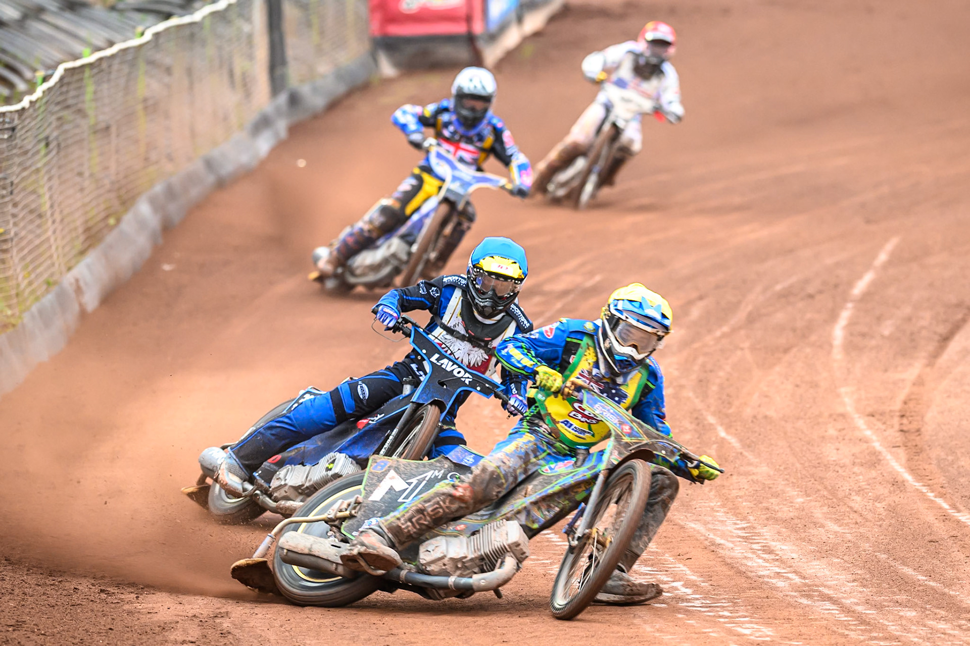 Michael West of Australia in Yellow leading Antoni Mencel of Poland in Blue, Joe Thompson of Great Britain in White and Slater Lightcap of The United States in Red during the FIM SGP2 Qualifying Round at the Peugeot Ashfield Stadium in Glasgow on Saturday 24th May 2025. (Photo: Ian Charles | MI News)