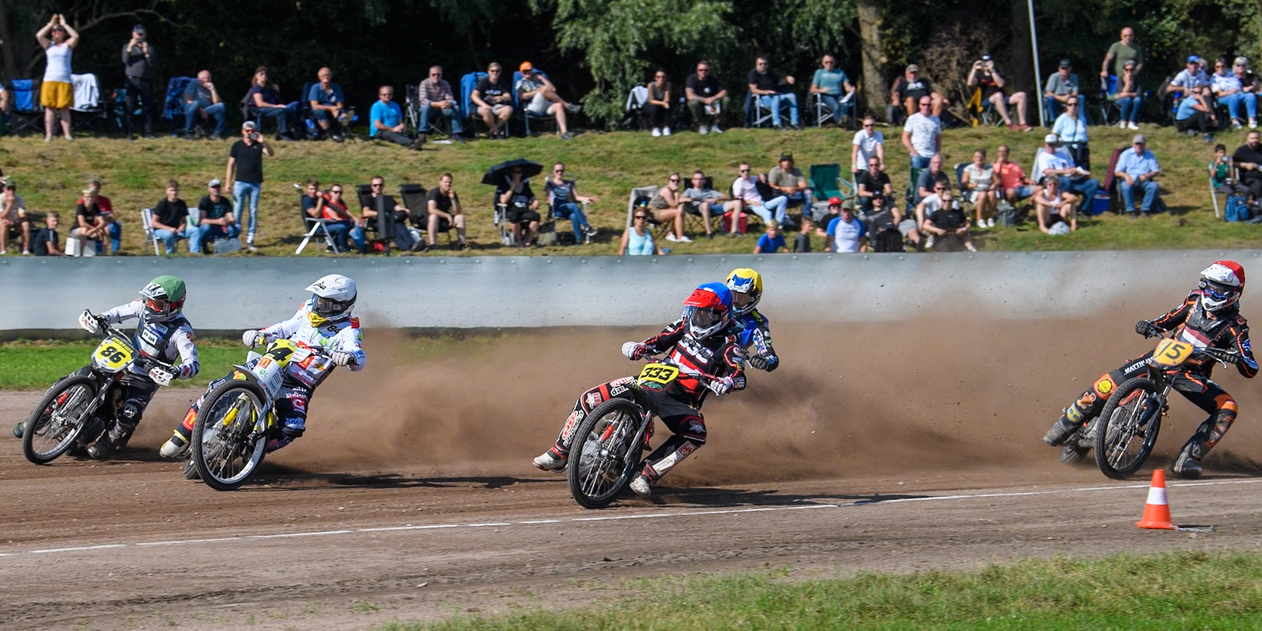 Kenneth Kruse Hansen (333) of Denmark in Blue rides inside Martin Smolinski (84) of Germany in White Hynek Stichauer (86) of Czech Republic  in Green  with Chris Harris (37)of Great Britain in Yellow and Henry van der Steen (15) of The Netherlands in Red behind during the FIM Long Track World Championship Final 5 at the Speed Centre Roden, Roden, Netherlands on Sunday 22nd September 2024. (Photo: Ian Charles | MI News)
