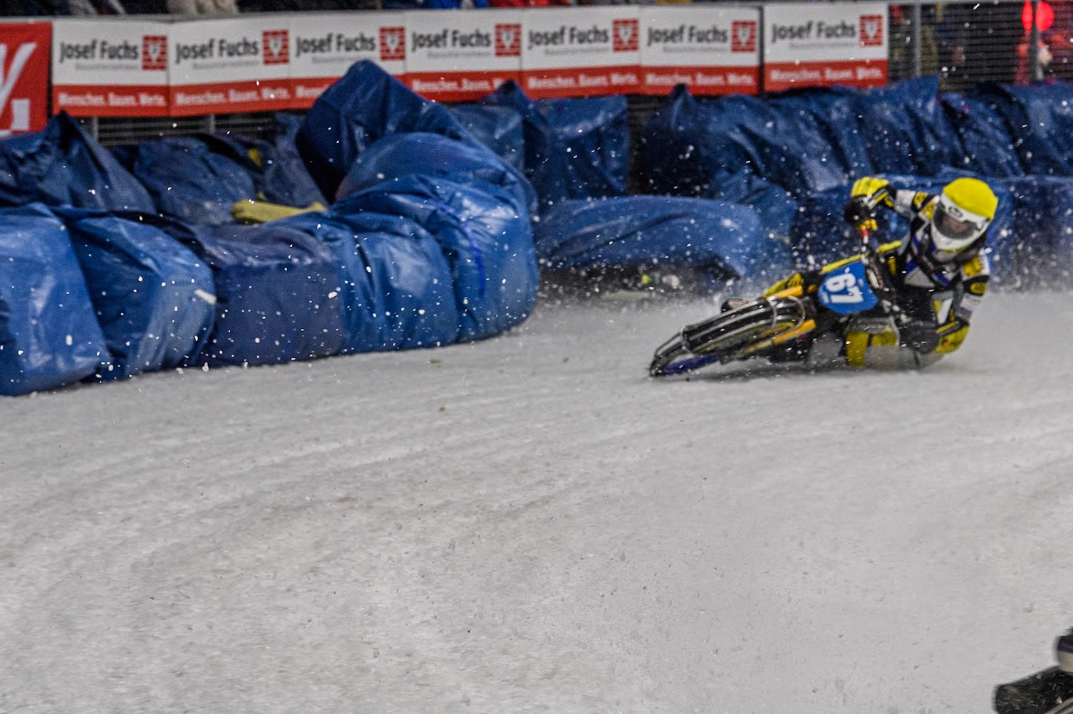 Finland's Aki Ala-Riihimäki (66) (White) leads  as Sweden's Martin Haarahiltunen (199)  (Blue) crashes out during the FIM Ice Speedway Gladiators World Championship Final 2 at the Max-Aicher-Arena, Inzell on Sunday 24 March 2024. (Photo: Ian Charles | MI News)