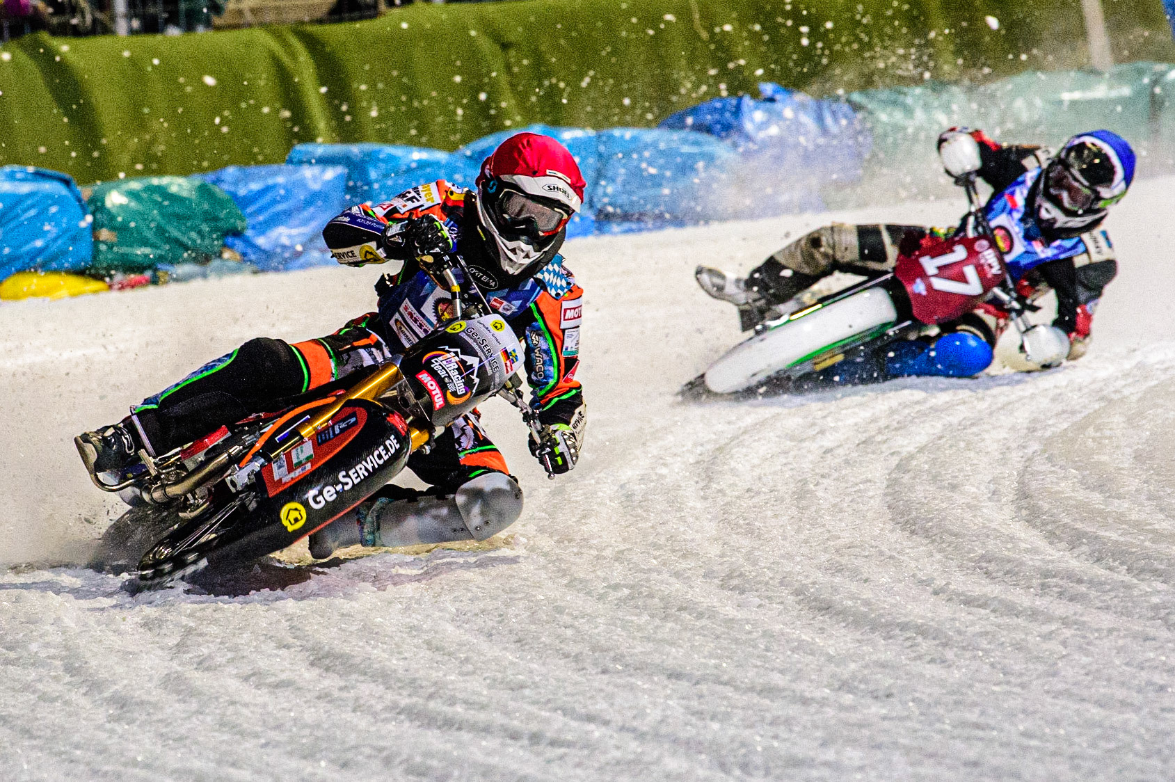 Markus Jell (Red) leads Andrej Divis (Blue) during the German Individual Ice Speedway Championship at Horst-Dohm-Eisstadion, Berlin on Friday 3rd March 2023. (Photo: Ian Charles | MI News)