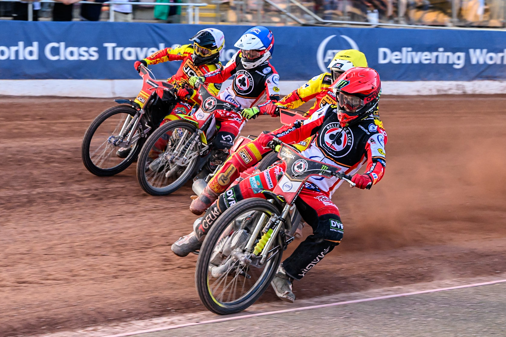 Belle Vue Aces' Jaimon Lidsey in Red rides inside Leicester Lions' Max Fricke  in Yellow, Belle Vue Aces' Tate Zischke in Blue and Leicester Lions' Ryan Douglas  in White during the Rowe Motor Oil Premiership match between Belle Vue Aces and Leicester Lions at the National Speedway Stadium, Manchester on Monday 14th July 2025. (Photo: Ian Charles | MI News)