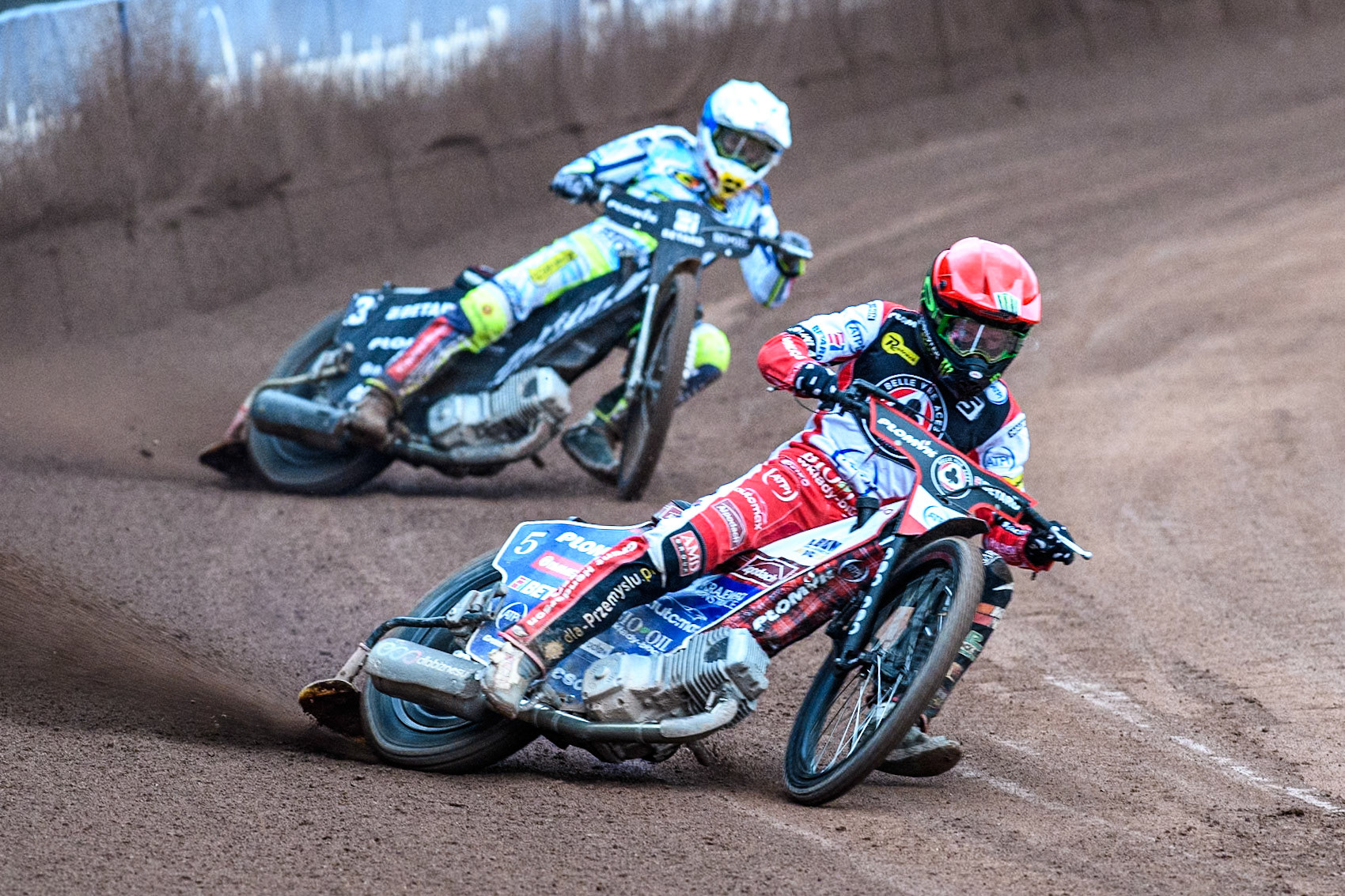 Belle Vue Aces' Dan Bewley  in Red leading Oxford Spires' Maciej Janowski  in White during the Rowe Motor Oil Premiership match between Belle Vue Aces and Oxford Spires at the National Speedway Stadium, Manchester on Monday 22nd July 2024. (Photo: Ian Charles | MI News)