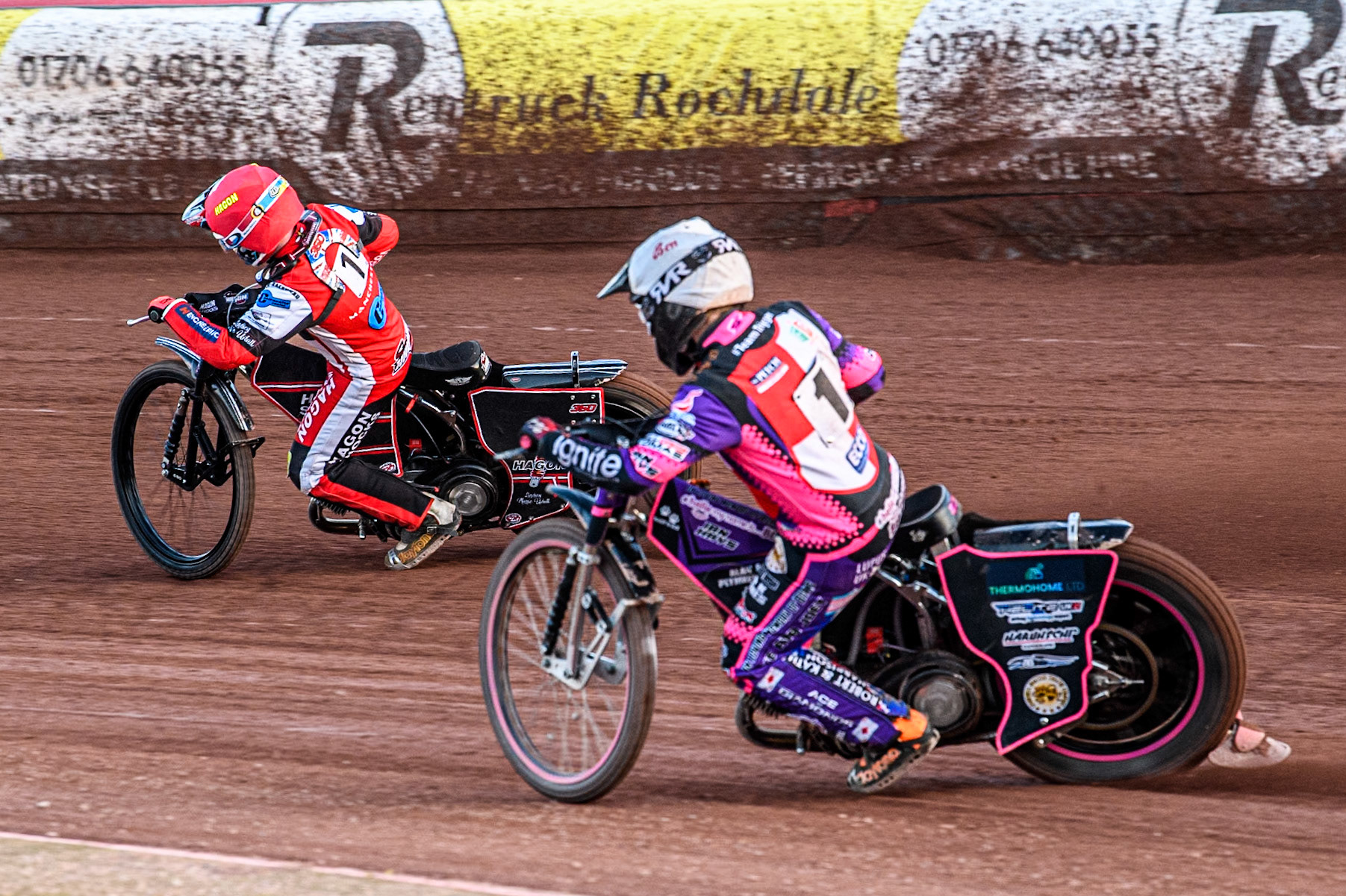 Middlesbrough Tigers' Ben Trigger in White chases Belle Vue Colts' Sam Hagon in Red during the WSRA National Development League match between Belle Vue Colts and Middlesbrough Tigers at the National Speedway Stadium, Manchester on Monday 17th June 2024. (Photo: Ian Charles | MI News)