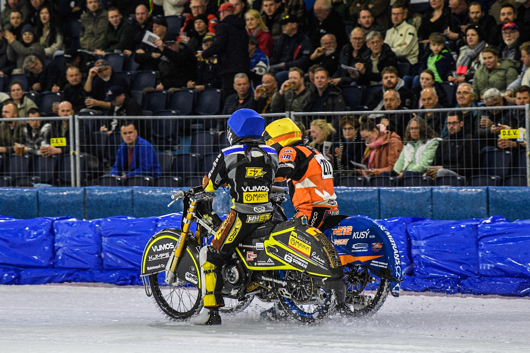 Heikki Huusko (67) of Finland in Blue congratulates Lukas Hutla (212) of the Czech Republic in Yellow after their heat during the FIM Ice Speedway Gladiators World Championship, Final 3 at the Ice Stadium, Thialf, Heerenveen on Saturday 5th April 2025. (Photo: Ian Charles | MI News)