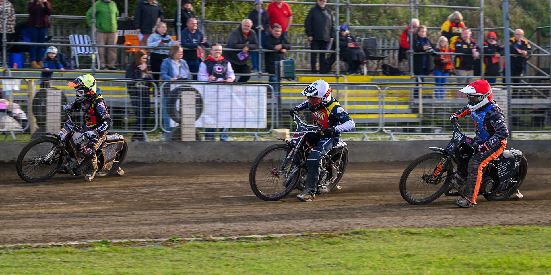 Ryan Ingram of Leicester Lion Cubs   in Yellow leading Ben Morley of Leicester Lion Cubs  in White  and Jack Roberts of Buxton Bulls   in Red during the WSRA National Development League match between Buxton Bulls and Leicester Lion Cubs at Hi-Edge Speedway, Buxton on Sunday 4th October 2026. (Photo: Ian Charles | MI News)