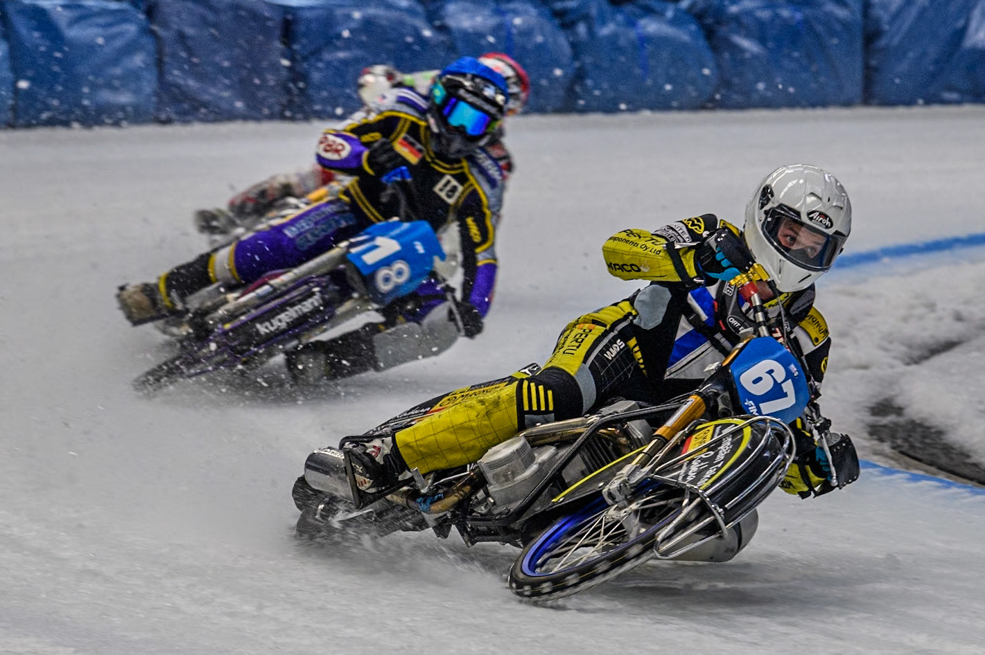 Finland's Heikki Huusko (67) (White) leads  Germany's Christoph Kirchner (18) (Blue) during the FIM Ice Speedway Gladiators World Championship Final 2 at the Max-Aicher-Arena, Inzell on Sunday 24 March 2024. (Photo: Ian Charles | MI News)