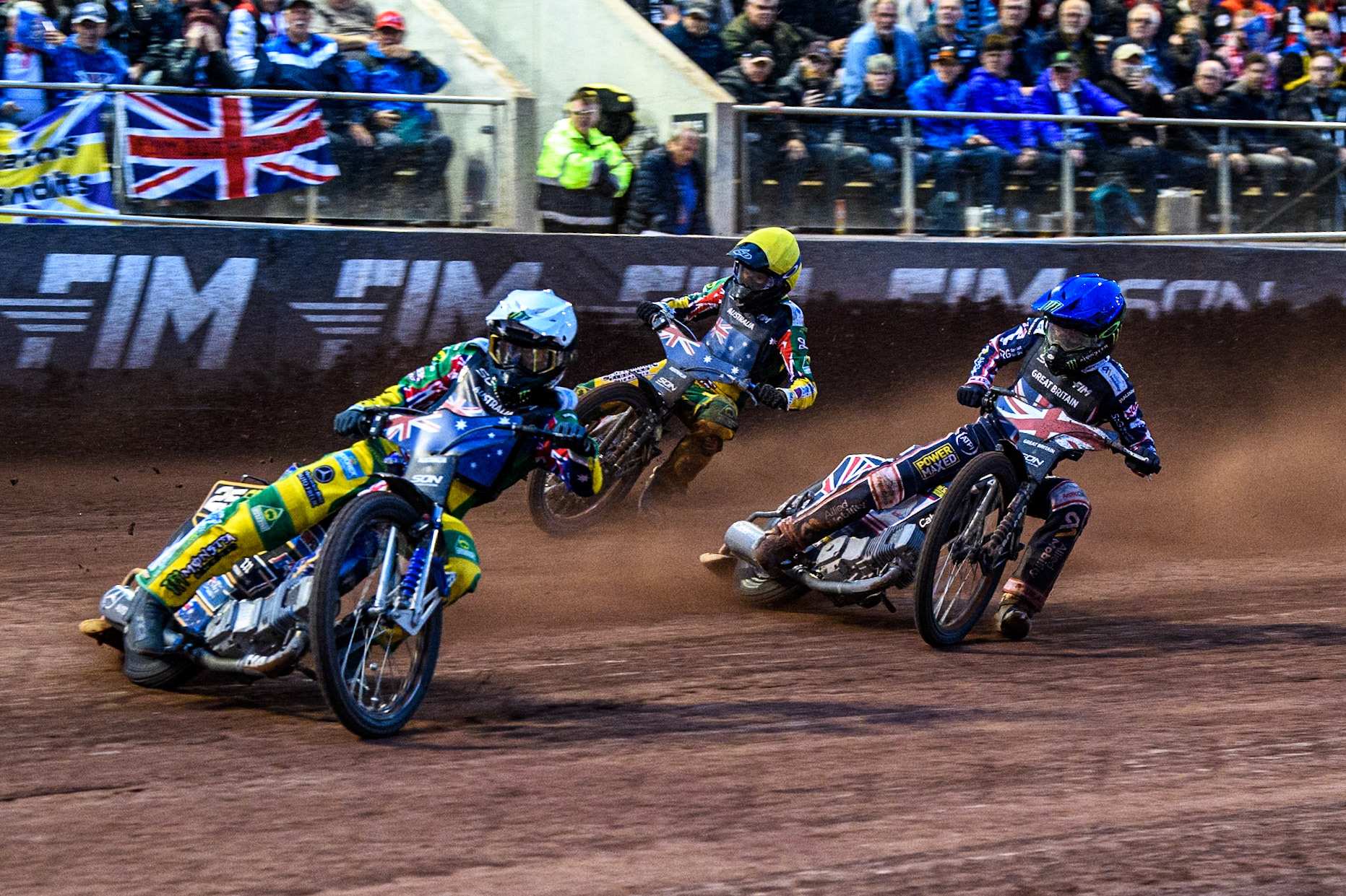 Jack Holder of Australia in White leading Dan Bewley of Great Britain in Blue and Brady Kurtz of Australia in Yellow during the Monster Energy FIM Speedway of Nation Final at the National Speedway Stadium, Manchester on Saturday 13th July 2024. (Photo: Ian Charles | MI News)