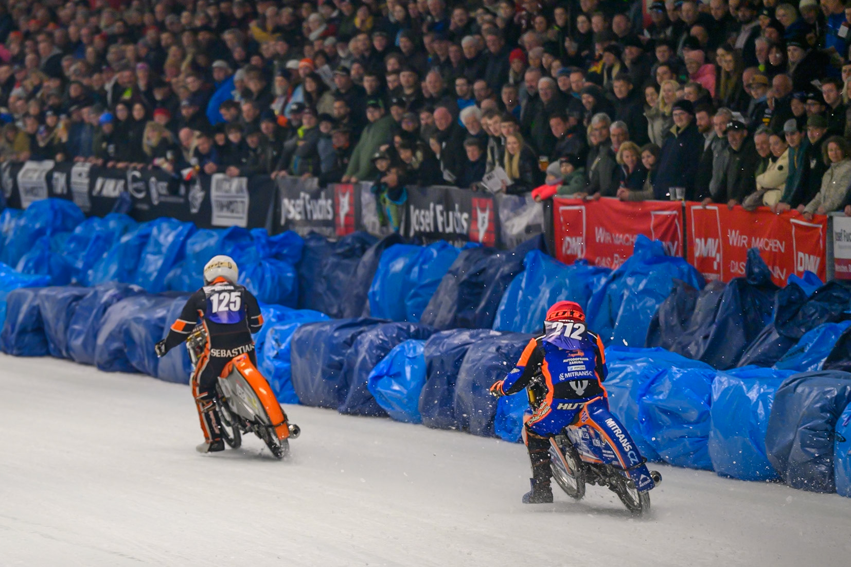 Lukas Hutla (212) of Czechia  in Red chases Sebastian Reitsma (125) of The Netherlands  in White during the Ice Speedway Gladiators World Championship Final 1 at Max-Aicher-Arena, Inzell on Saturday 14th March 2026. (Photo: Ian Charles | MI News)
