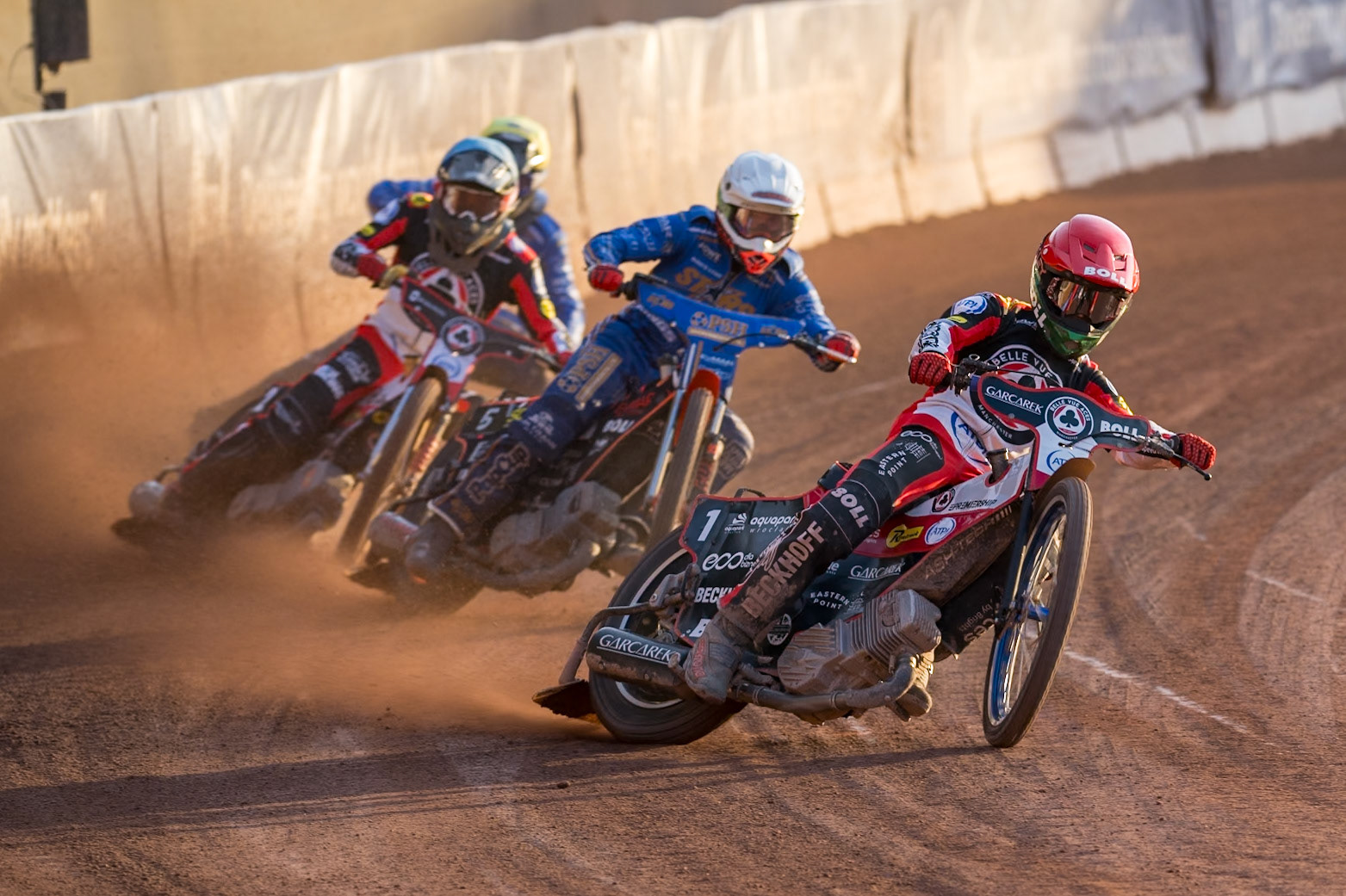 Brady Kurtz of Belle Vue Aces in Red leading Jan Kvech of Kings Lynn Stars in White Norick Blödorn of Belle Vue Aces in Blue and Jody Scott of Kings Lynn Stars in Yellow during the Rowe Motor Oil Premiership match between Belle Vue Aces and King's Lynn Stars at the National Speedway Stadium, Manchester on Monday 10th August 2026. (Photo: Ian Charles | MI News)