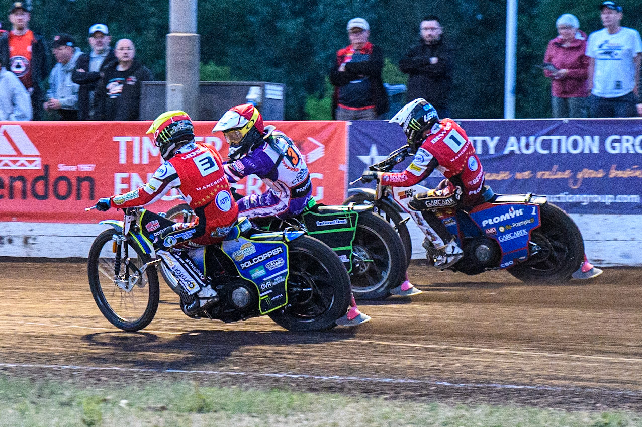 Jaimon Lidsey (Yellow), Benjamin Basso (Red) and Dan Bewley (White) battle on the back straight during the Sports Insure Premiership match between Peterborough and Belle Vue Aces at East of England Showground, Peterborough on Monday 26th June 2023. (Photo: Ian Charles | MI News)