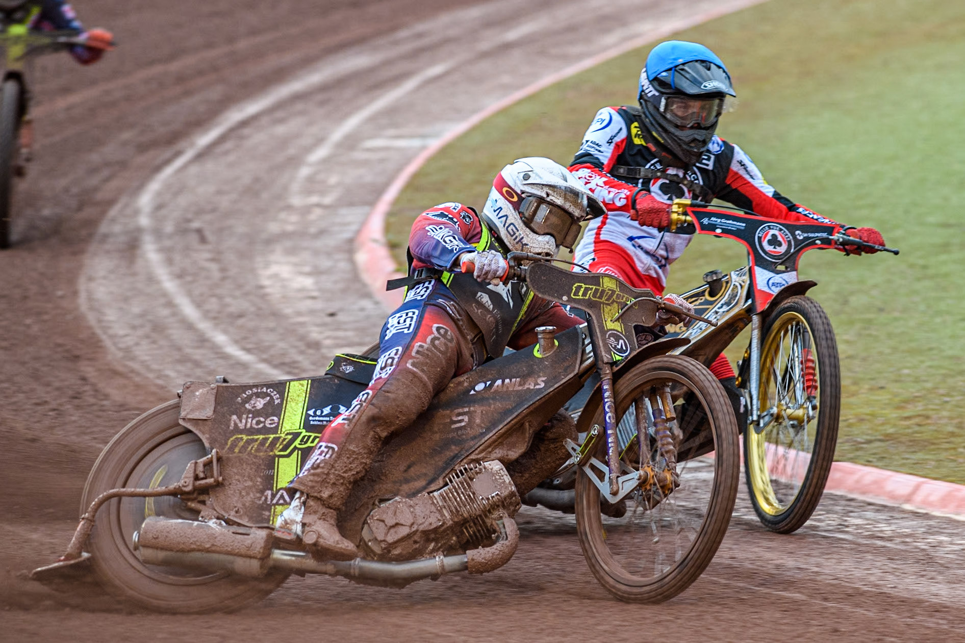 Ipswich Witches' Emil Sayfutdinov in White rides outside Belle Vue Aces' Norick Blödorn in Blue during the Rowe Motor Oil Premiership match between Belle Vue Aces and Ipswich Witches at the National Speedway Stadium, Manchester on Monday 22nd April 2024. (Photo: Ian Charles | MI News)