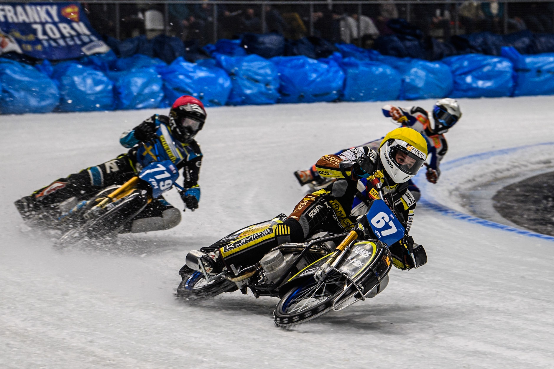 Heikki Huusko (67) of Finland in Yellow leading Filip Jäger (719) of Sweden in Red and Jasper Iwema (800) of The Netherlands in White during the Ice Speedway Gladiators World Championship Final 2 at Max-Aicher-Arena, Inzell on Sunday 16th March 2025. (Photo: Ian Charles | MI News)