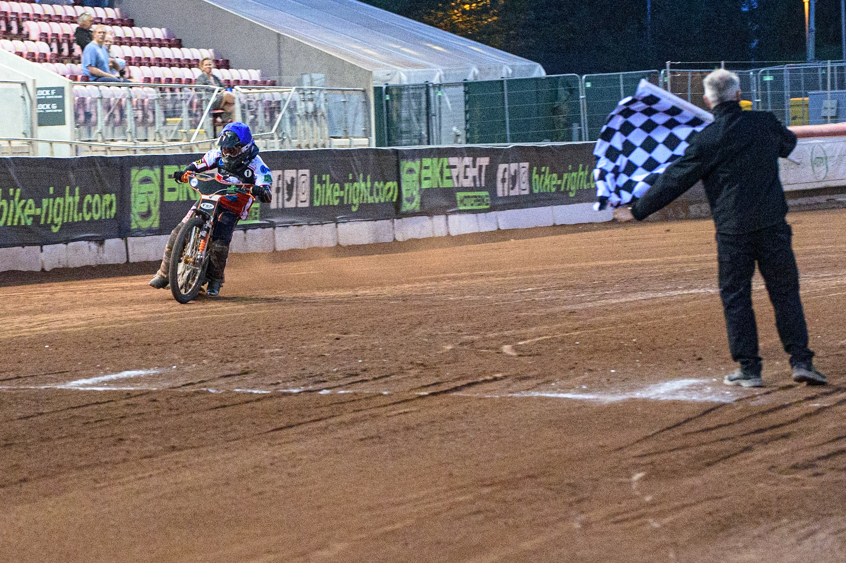 MANCHESTER, UK. JULY 23RD Jack Smith  takes the chequered flag to give the Belle Vue Cool Running Colts  a match win during the National Development League match between Belle Vue Colts and Eastbourne Seagulls at the National Speedway Stadium, Manchester on Friday 23rd July 2021. (Credit: Ian Charles | MI News)