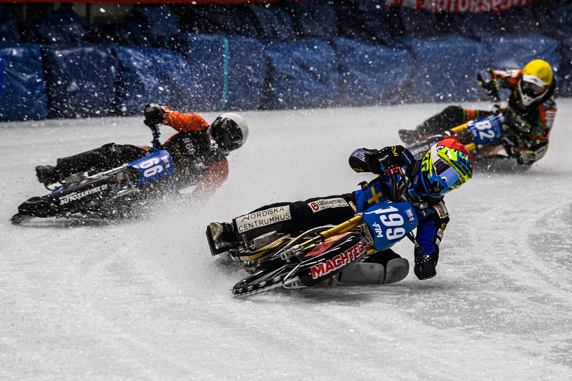 Sweden's Martin Haarahiltunen (199) (Red) leads  Finland's Aki Ala-Riihimäki (66) (White) and Germany's Markus Jell (82) (Yellow) during the FIM Ice Speedway Gladiators World Championship Final 1 at the Max-Aicher-Arena, Inzell on Saturday 23 March 2024. (Photo: Ian Charles | MI News)