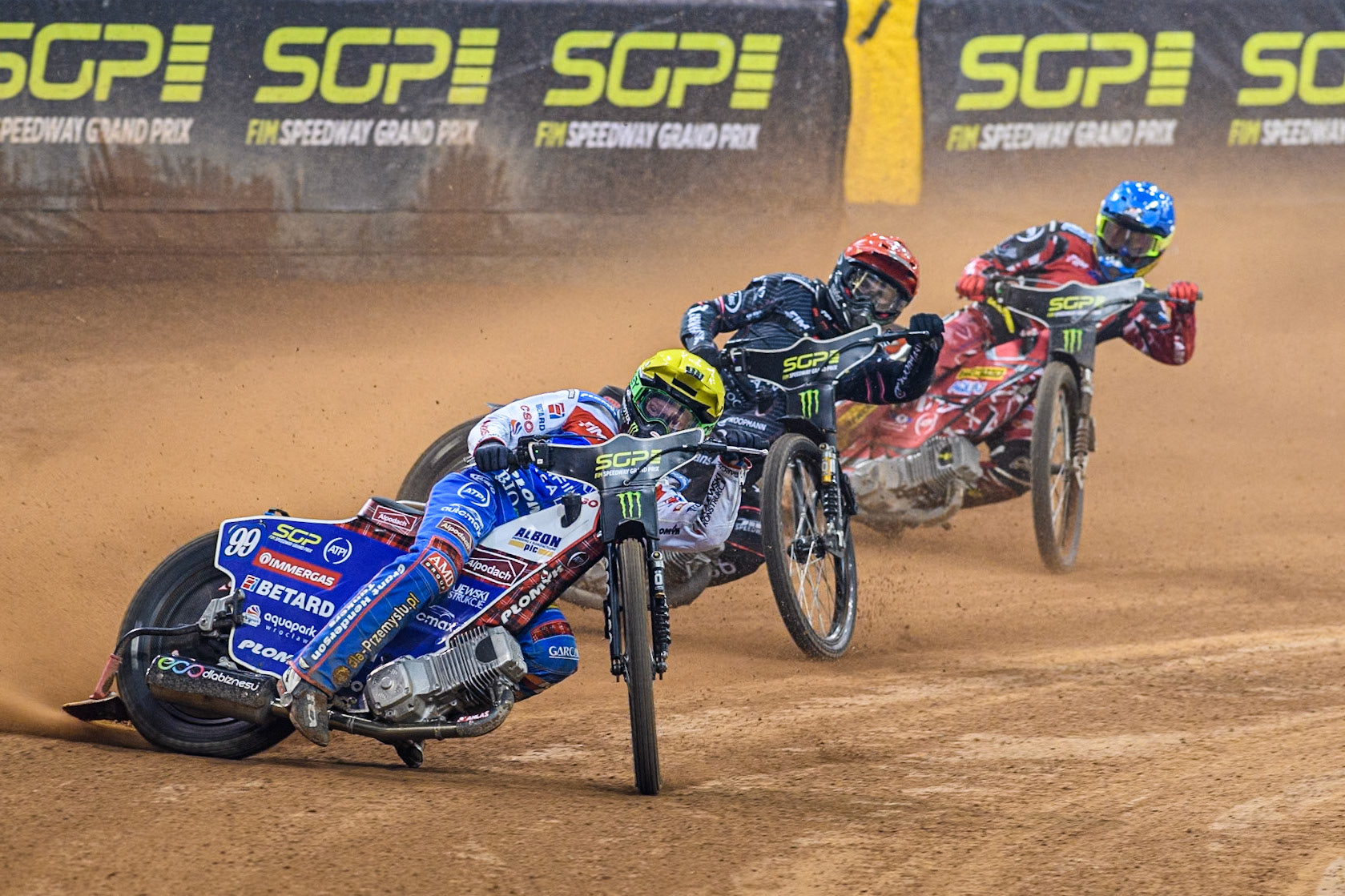 Daniel Bewley (99) of Great Britain in Yellow leading Kai Huckenbeck (744) of Germany in Red and Max Fricke (46) of Australia in Blue during the FIM Speedway Grand Prix of Great Britain at The Principality Stadium, Cardiff on Saturday 17th August 2024. (Photo: Ian Charles | MI News)