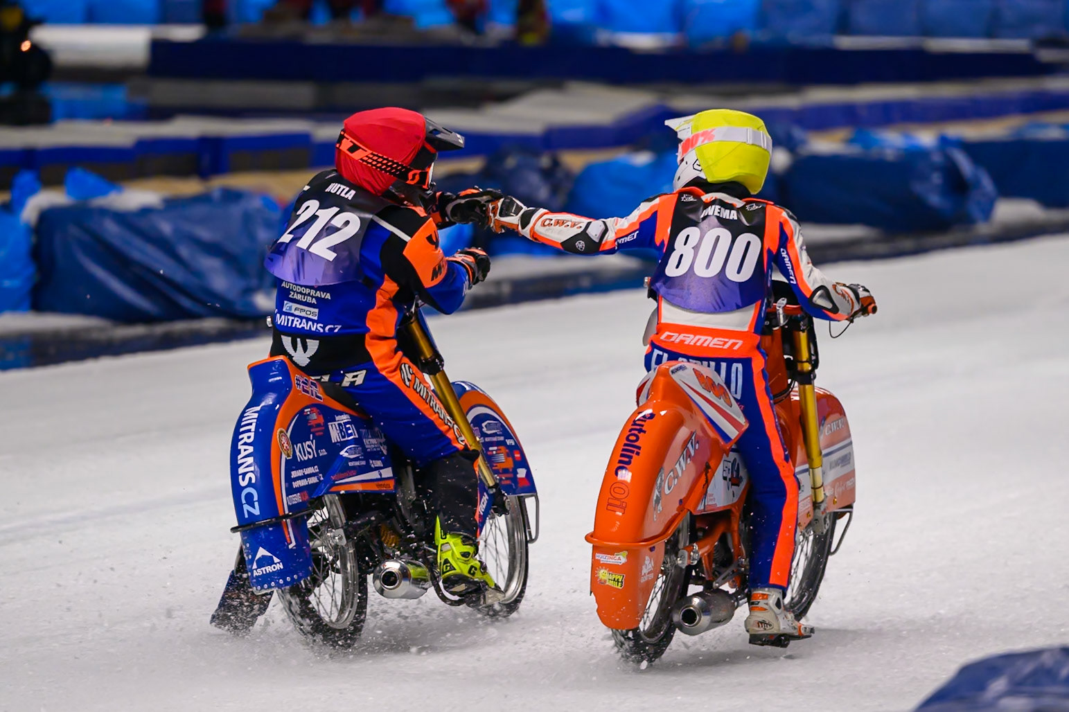 Lukas Hutla (212) of Czechia in Red congratulates Jasper Iwema (800) of The Netherlands  on beating him during the Ice Speedway Gladiators World Championship Final 1 at Max-Aicher-Arena, Inzell on Saturday 14th March 2026. (Photo: Ian Charles | MI News)