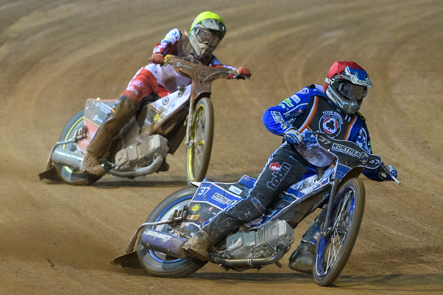 Chris Harris in Red leading Norick Blodorn in Yellow during the Peter Craven Memorial Trophy at the National Speedway Stadium, Manchester on Monday 17th March 2025. (Photo: Ian Charles | MI News)