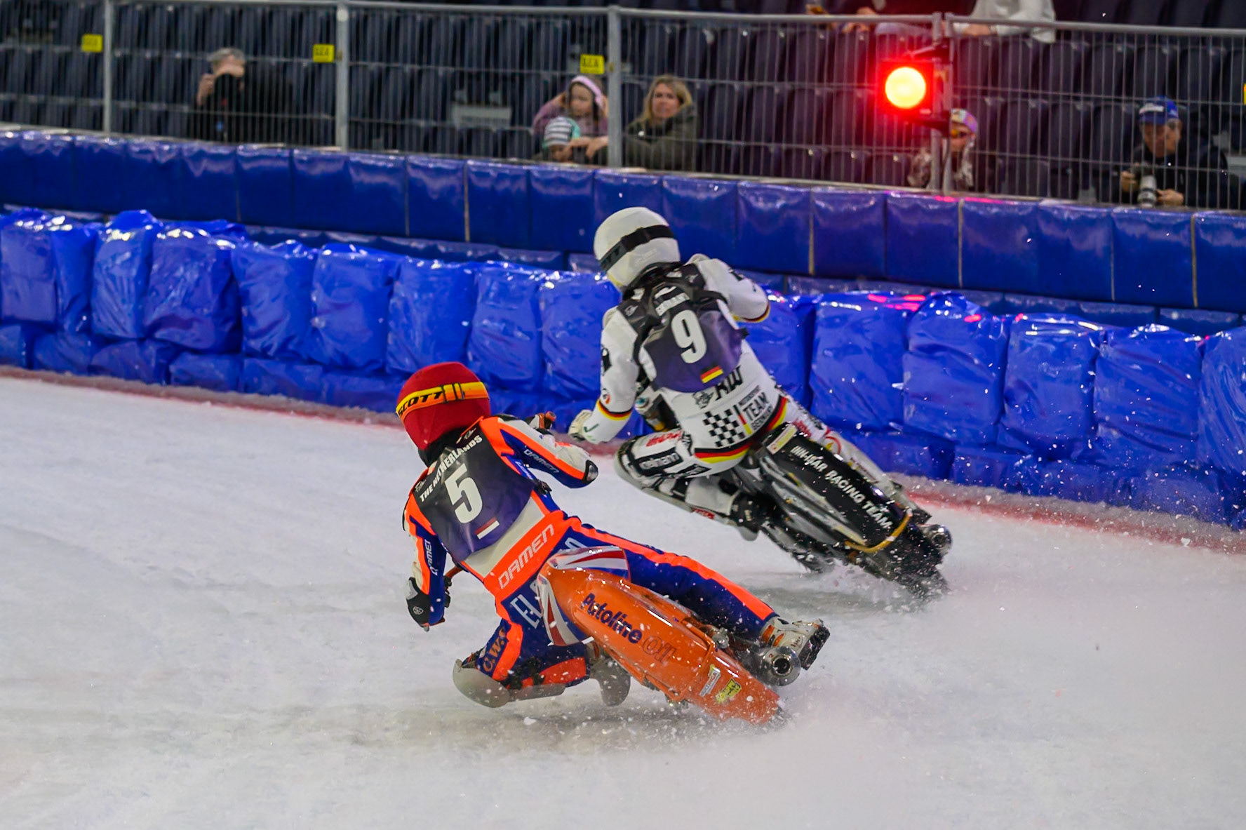 Jasper Iwema (5) of The Netherlands  in Red chases Max Niedermaier (9) of Germany  as the red stop light comes on to stop the heat during the FIM Ice Speedway Of Nations at Ice Rink Thialf, Heerenveen on Sunday 12th April 2026. (Photo: Ian Charles | MI News)