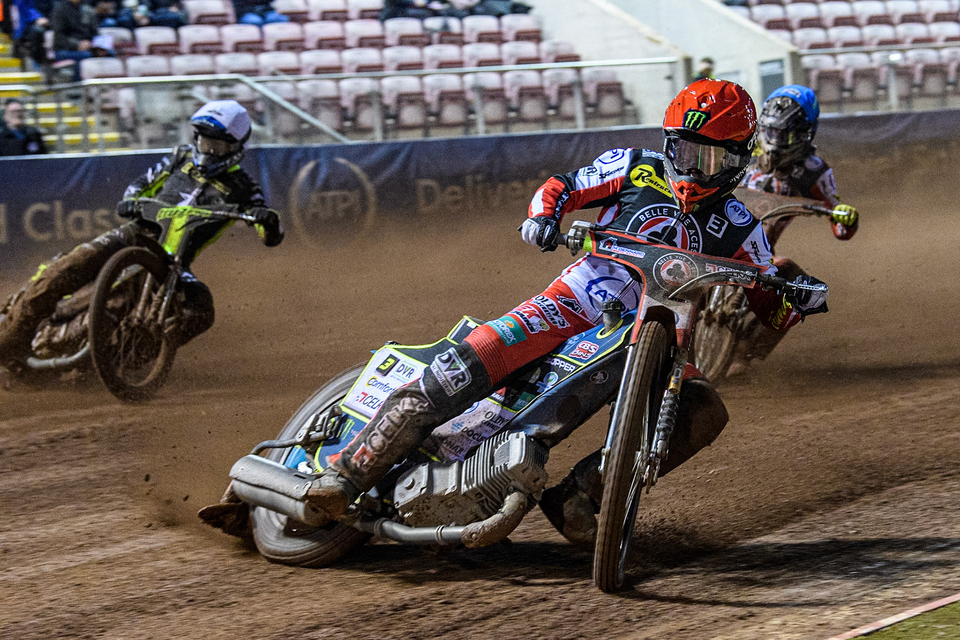 Belle Vue Aces' Jaimon Lidsey in Red leading Ipswich Witches' Adam Ellis in White and Belle Vue Aces' Connor Bailey in Blue during the Rowe Motor Oil Premiership match between Belle Vue Aces and Ipswich Witches at the National Speedway Stadium, Manchester on Monday 22nd April 2024. (Photo: Ian Charles | MI News)