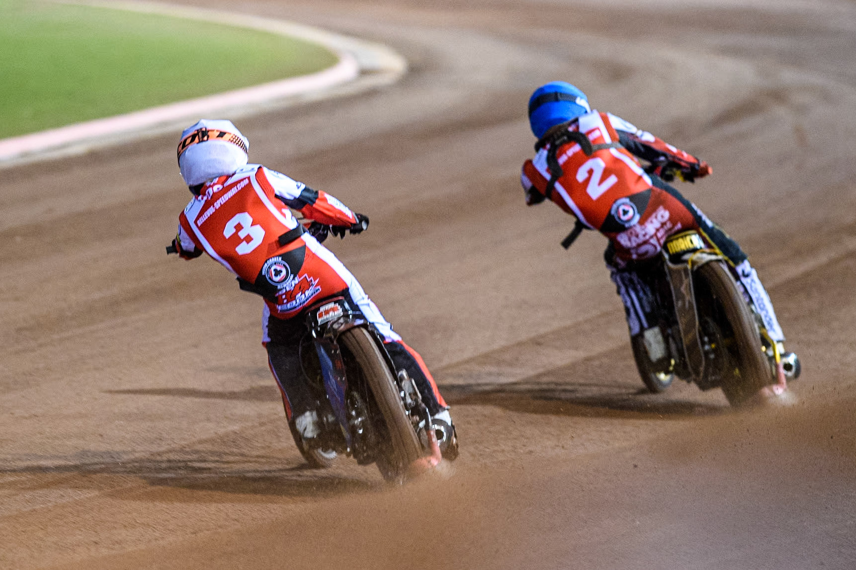 Australia's Ben Cook (White) chases Germany's Norick Blödorn (Blue) during the Peter Craven Memorial Trophy meeting at the National Speedway Stadium, Manchester on Monday 18th March 2024. (Photo: Ian Charles | MI News)