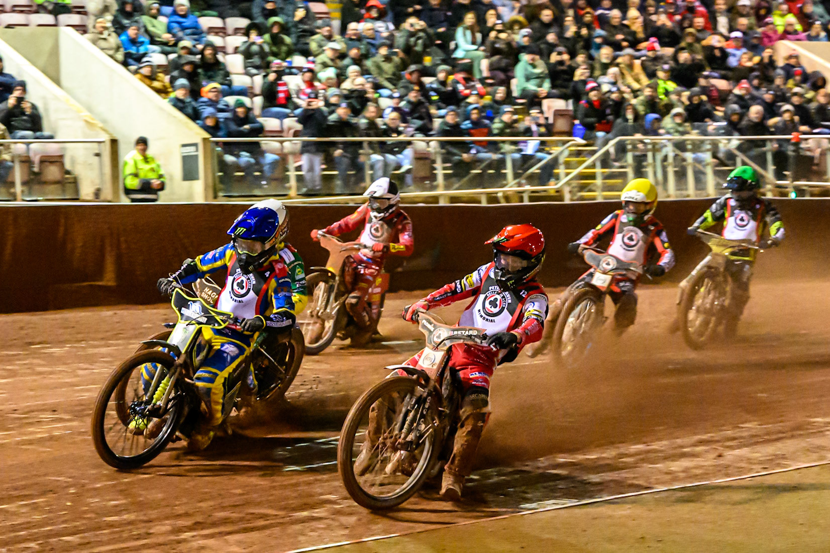The Six Rider Final: Dan Bewley of Great Britain in Red and Chris Holder of Australia in Blue lead into the first turn during the Peter Craven Memorial Trophy at the National Speedway Stadium, Manchester, on Monday 16th March 2026. (Photo: Ian Charles | MI News)