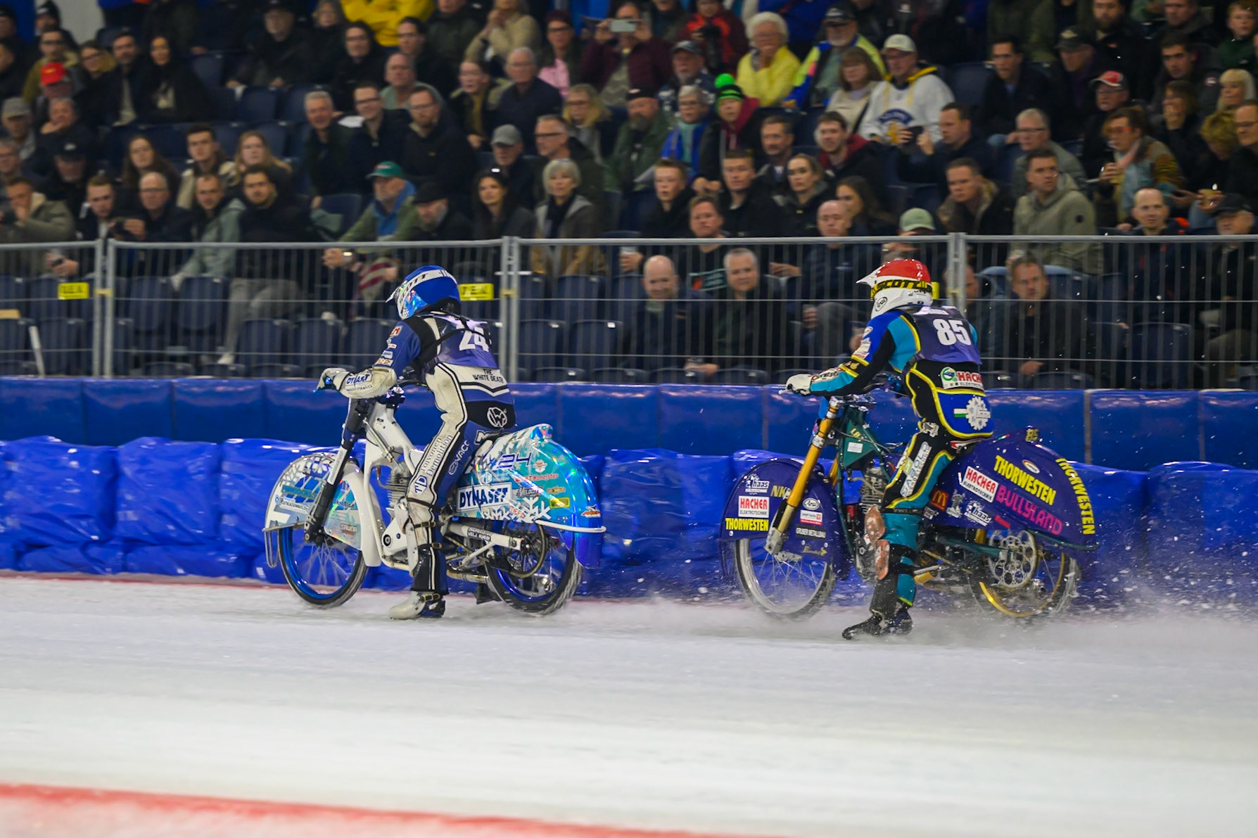 Luca Bauer (85) of Italy/Germany  in Red chases 24\ in Blue during the FIM Ice Speedway Gladiators World Championship Final 3 at Ice Rink Thialf, Heerenveen on Saturday 11th April 2026. (Photo: Ian Charles | MI News)
