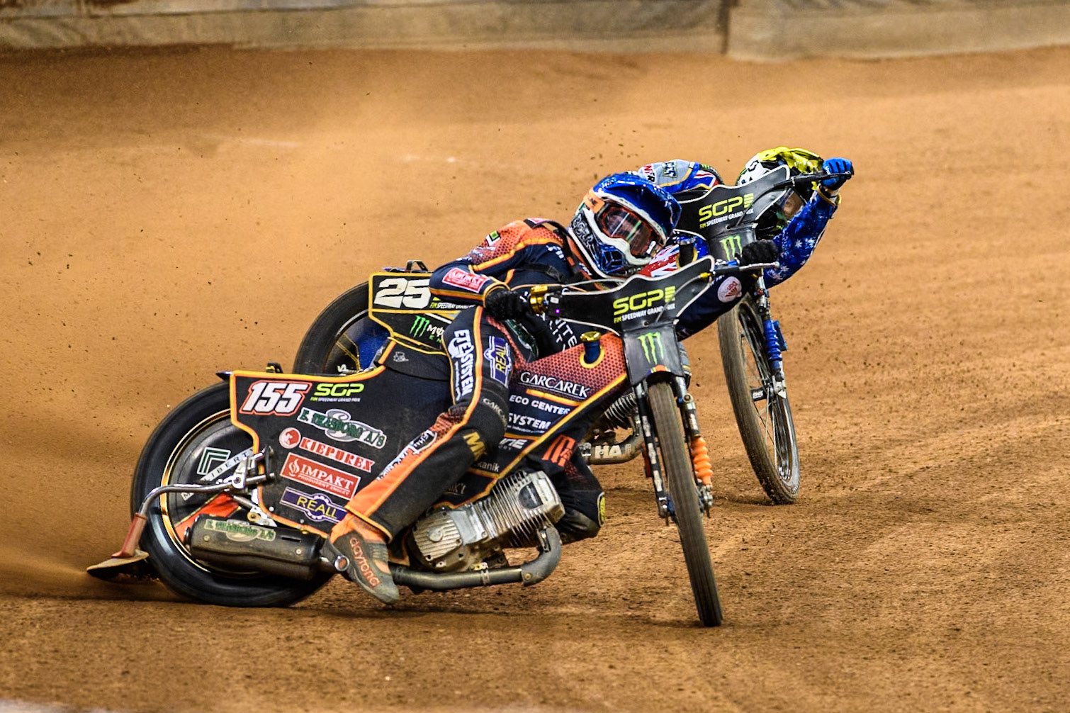 Mikkel Michelsen (155) of Denmark in Blue leading Jack Holder (25) of Australia in Yellow during the FIM Speedway Grand Prix of Great Britain at The Principality Stadium, Cardiff on Saturday 17th August 2024. (Photo: Ian Charles | MI News)