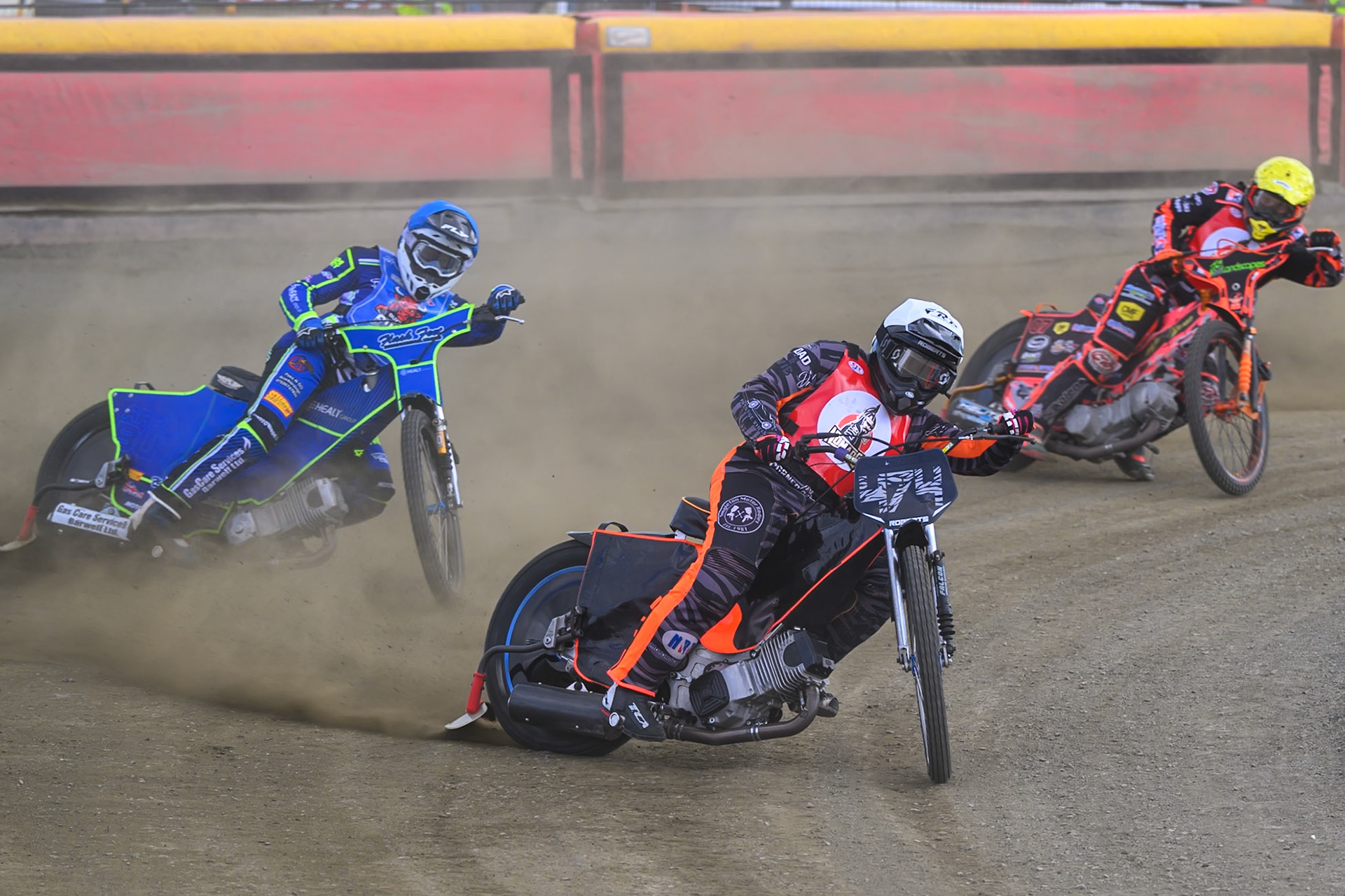 Jack Roberts of NDL Nomads    in White leading Arran Butcher of Buxton Bulls  in Blue and Alex Spooner of NDL Nomads   in Yellow during the  Challenge match between Buxton Bulls and NDL Nomads at Hi-Edge Speedway, Buxton on Sunday 19th April 2026. (Photo: Ian Charles | MI News)
