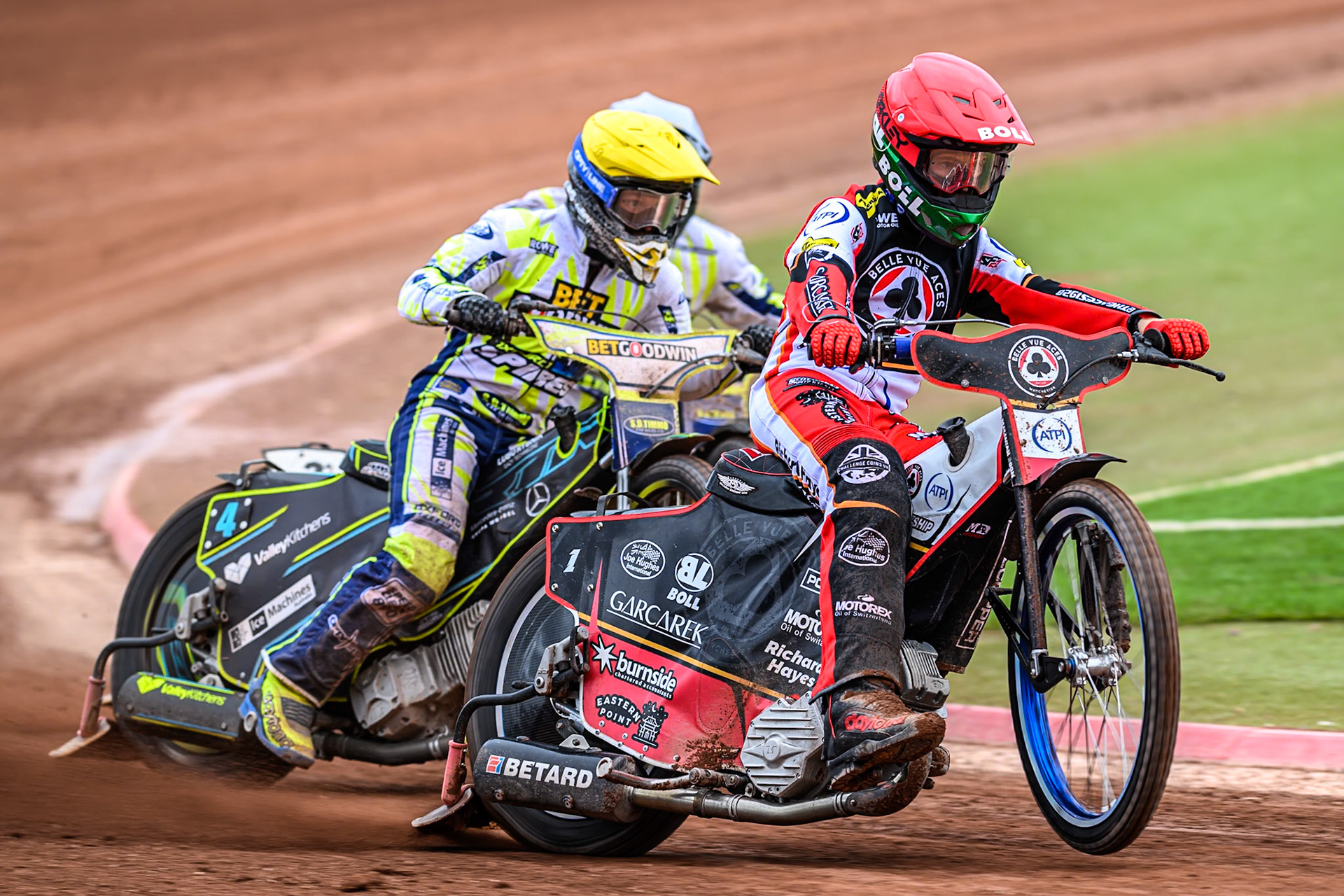 Belle Vue Aces' Brady Kurtz in Red leading Oxford Spires' Rohan Tungate in Yellow and Oxford Spires' Erik Riss in White during the Rowe Motor Oil Premiership match between Belle Vue Aces and Oxford Spires at the National Speedway Stadium, Manchester on Monday 26th May 2025. (Photo: Ian Charles | MI News)