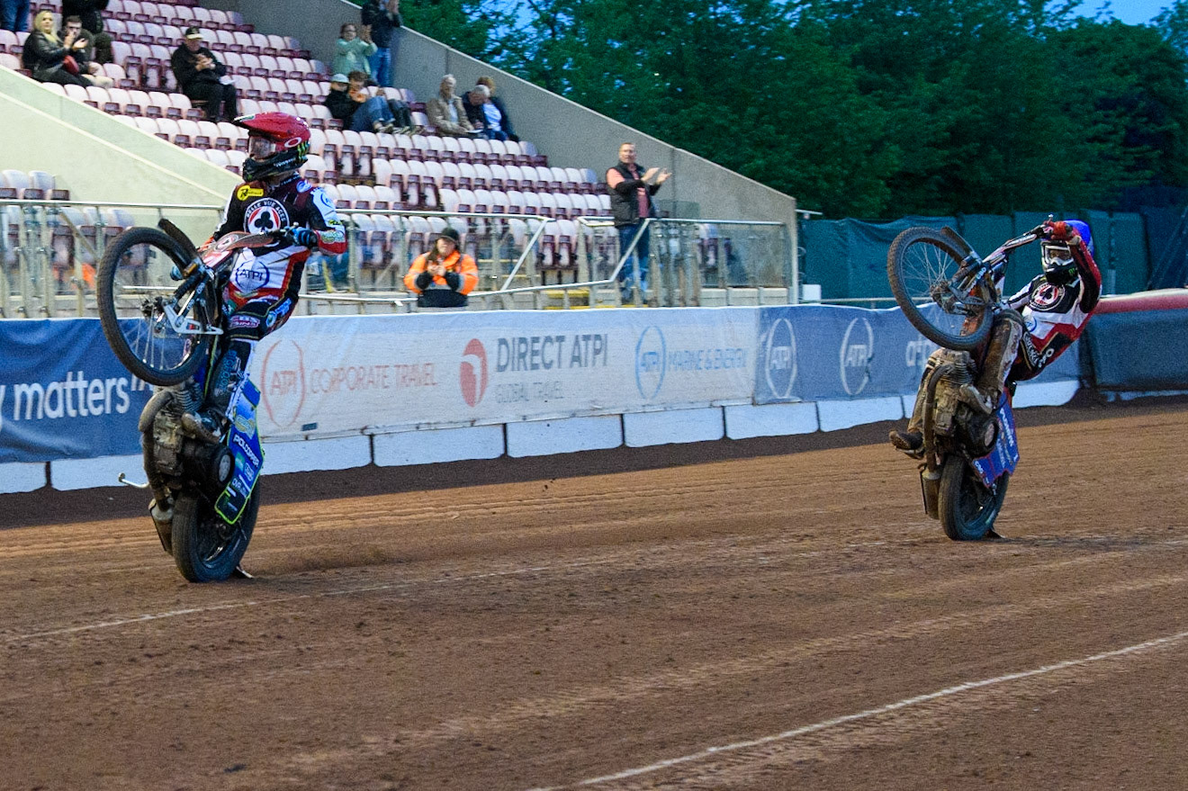 Jaimon Lidsey (Red) and Jaimon Lidsey (Blue) celebrate with a wheelie during the Sports Insure Premiership Knock Out Cup Quarter Final 2nd Leg between Belle Vue Aces and Wolverhampton Wolves at the National Speedway Stadium, Manchester on Thursday 18th May 2023. (Photo: Ian Charles | MI News)