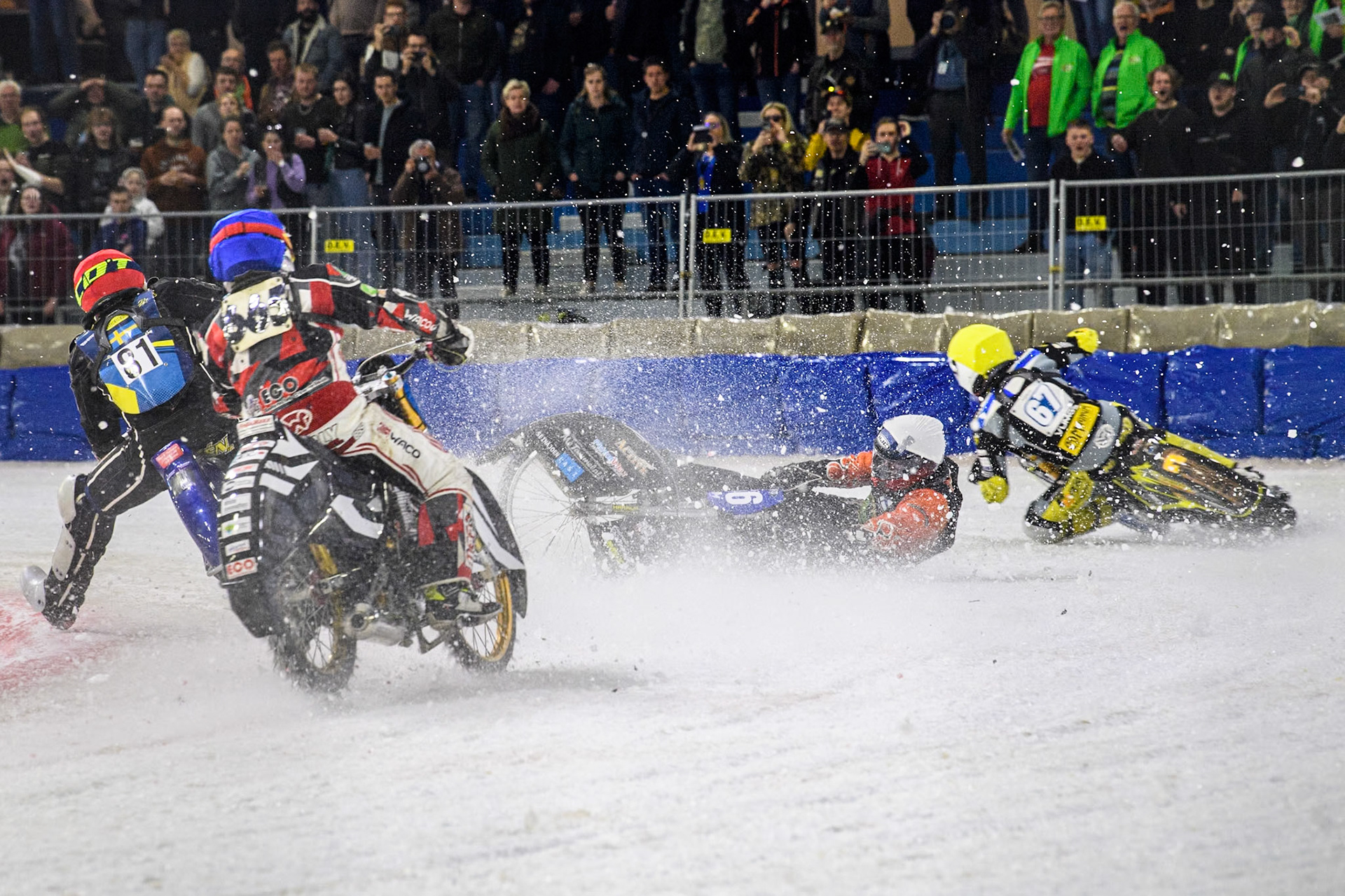 Finland's Aki Ala-Riihimäki (66) in White spins off leaving Austria's Charly Ebner (665) in Blue with nowhere to go during the FIM Ice Speedway Gladiators World Championship Final 4 at Ice Rink Thialf, Heerenveen on Sunday 7th April 2024. (Photo: Ian Charles | MI News)